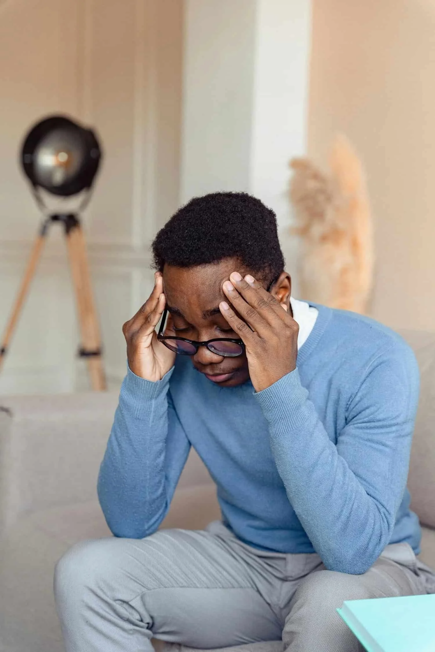 man with head in hands