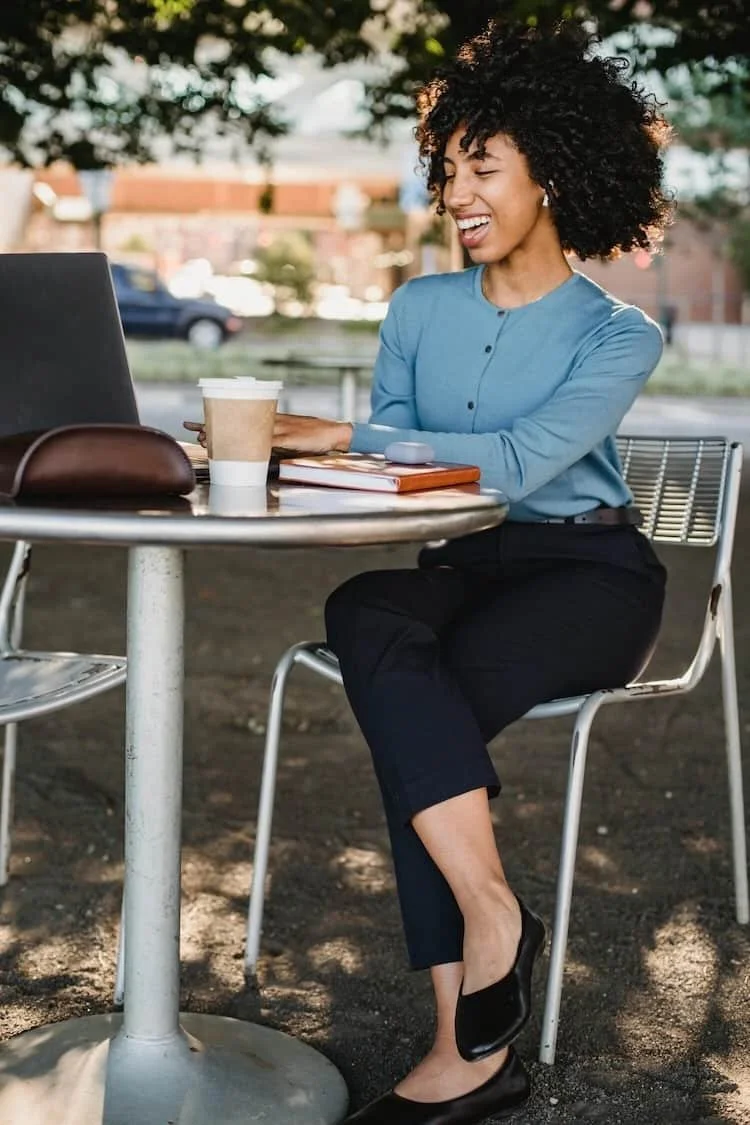 woman working at an outdoor table