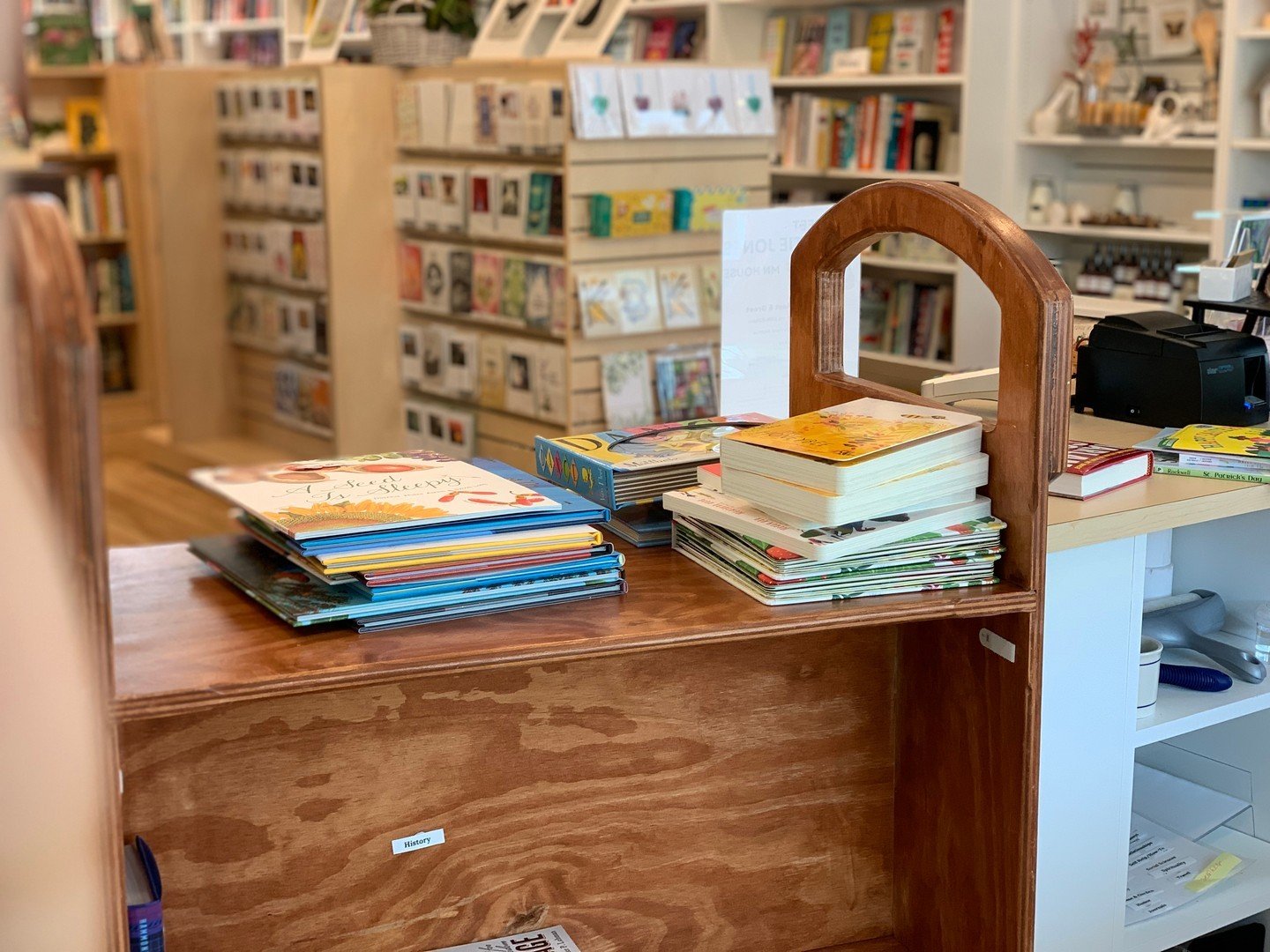 This Friday, we are taking the time to enjoy the little snippets of joy in the store! 

One of our favorite parts of bookselling is our beloved book cart, even if it does make a bit of noise when we wheel it around. It makes us feel like real booksel