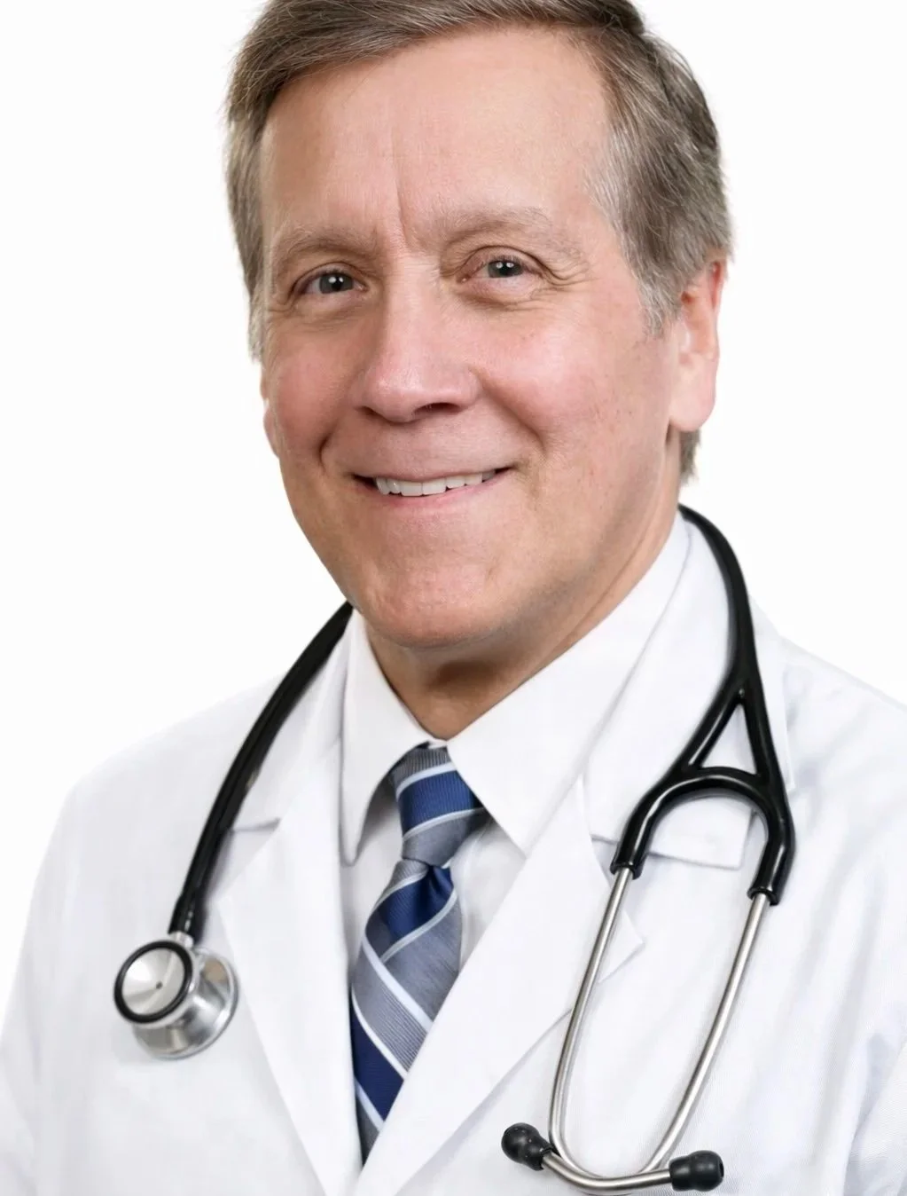 Portrait of a smiling male doctor wearing a white coat and a striped blue tie, with a stethoscope around his neck.