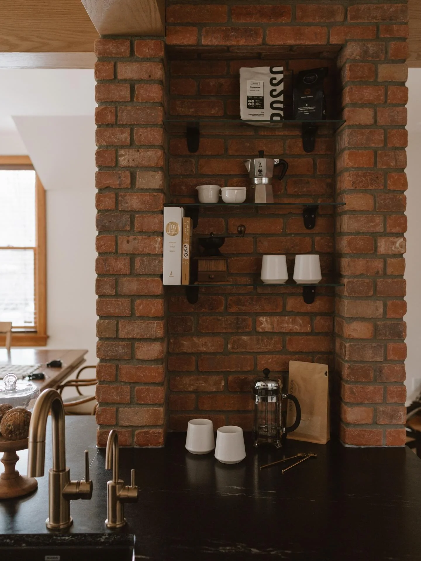 Happy Friday - may your coffee be strong &amp; your day as warm and layered as #MED_garneau!

(Don&rsquo;t ask how many hours we spent ensuring the brick related perfectly to the beam and counter edges&hellip;we lose sleep over these things!)

Photog
