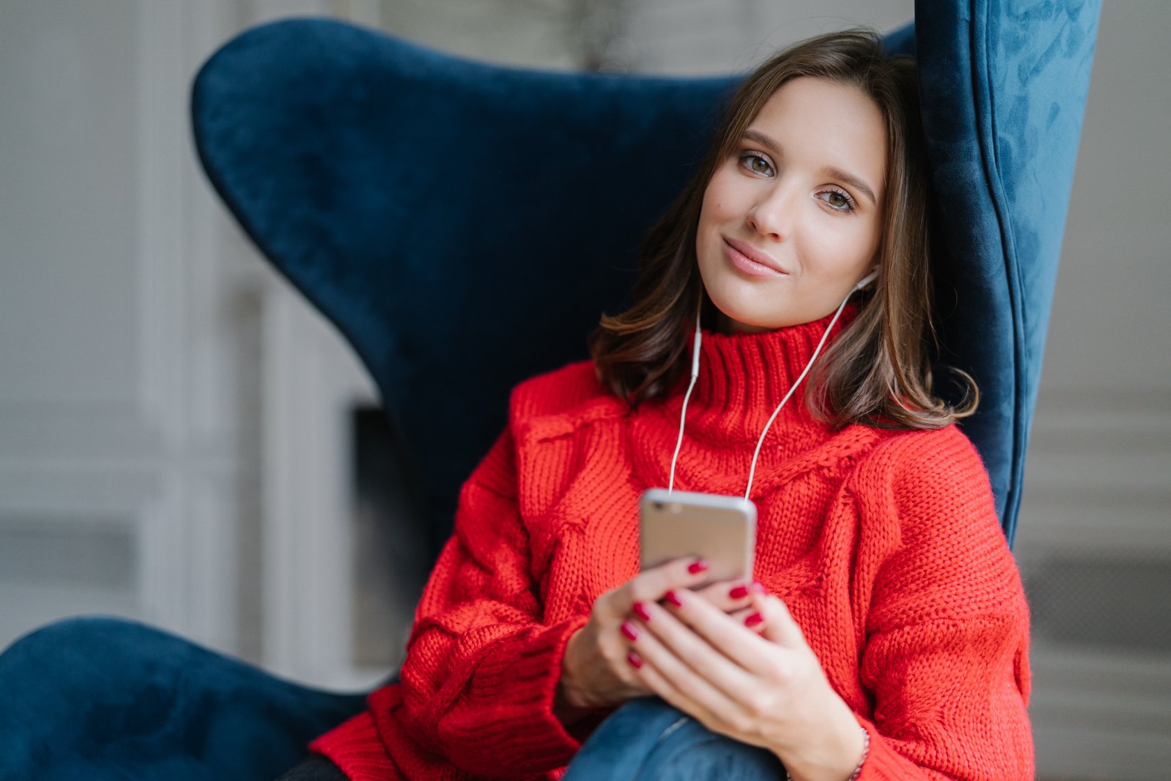 Woman with iphone and headphones
