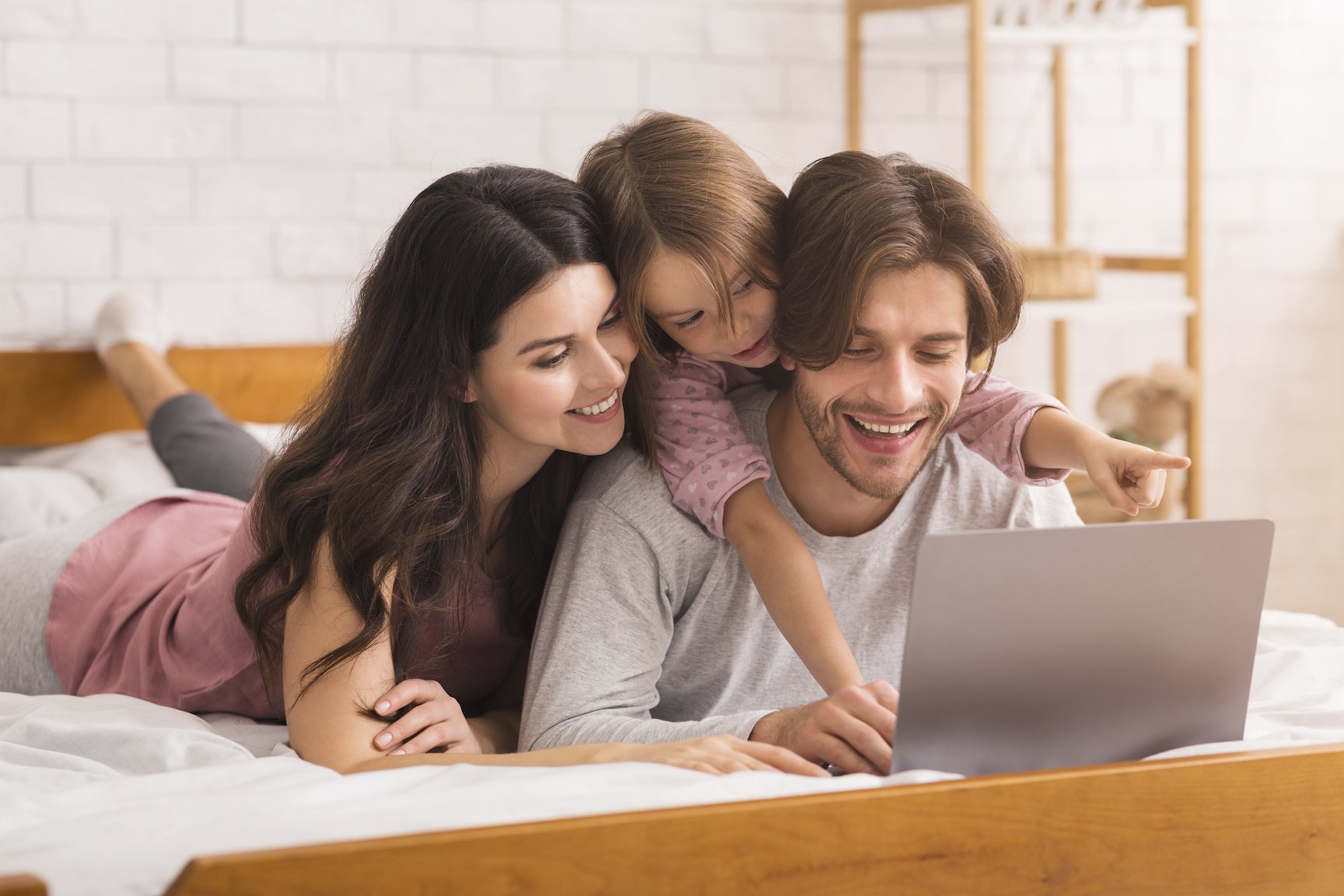 A family watching a show on laptop