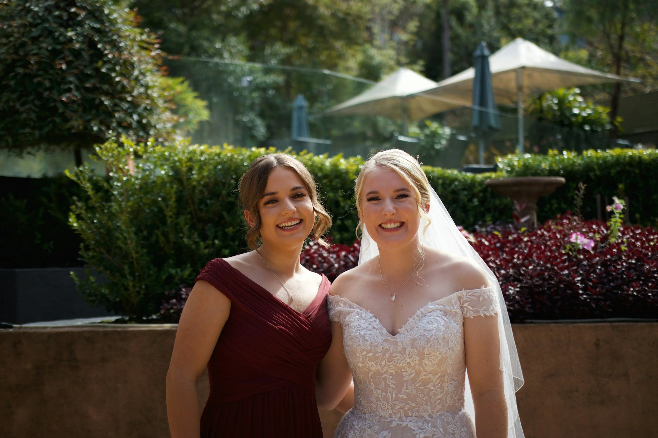 Bride getting ready with her bridesmaids — a great reminder to reflect on meaningful friendship moments in your Maid of Honor speech.