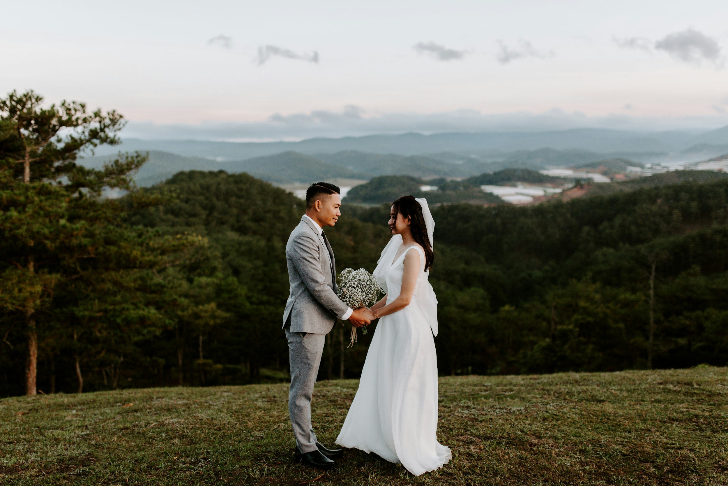 Bride and groom smiling at each other during their wedding celebration