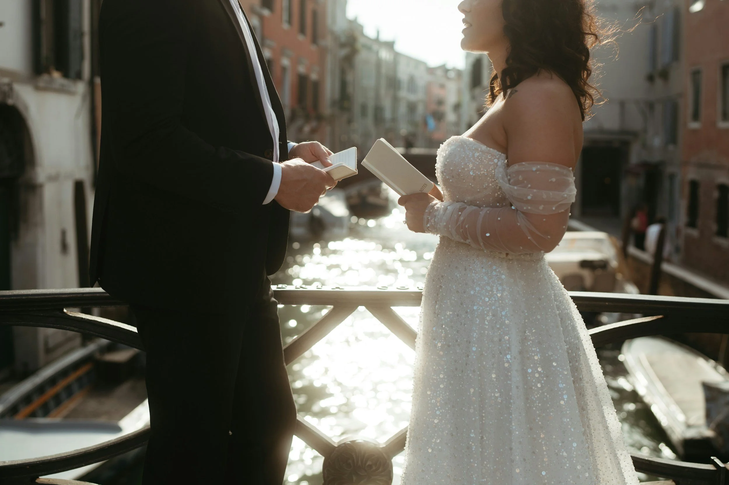 bride and groom reading their custom written wedding vows to each other during Christian wedding ceremony