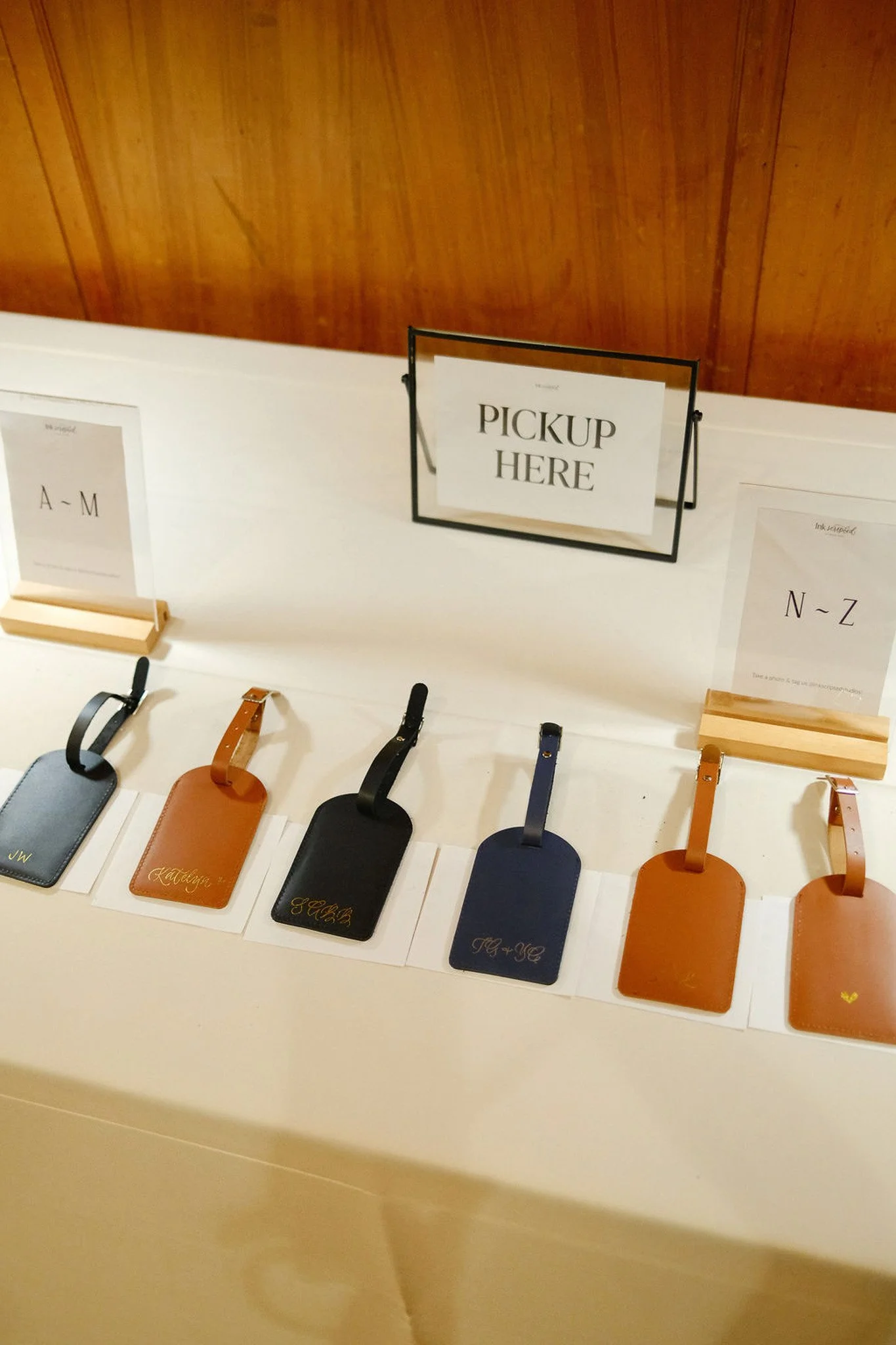 hand-foiled-faux-leather-luggage-tag-customization-gifting-brand-corporate-event-activation-black-gold-foil-initials-name-hot-heat-foiling-embossing-completed-pickup.jpg