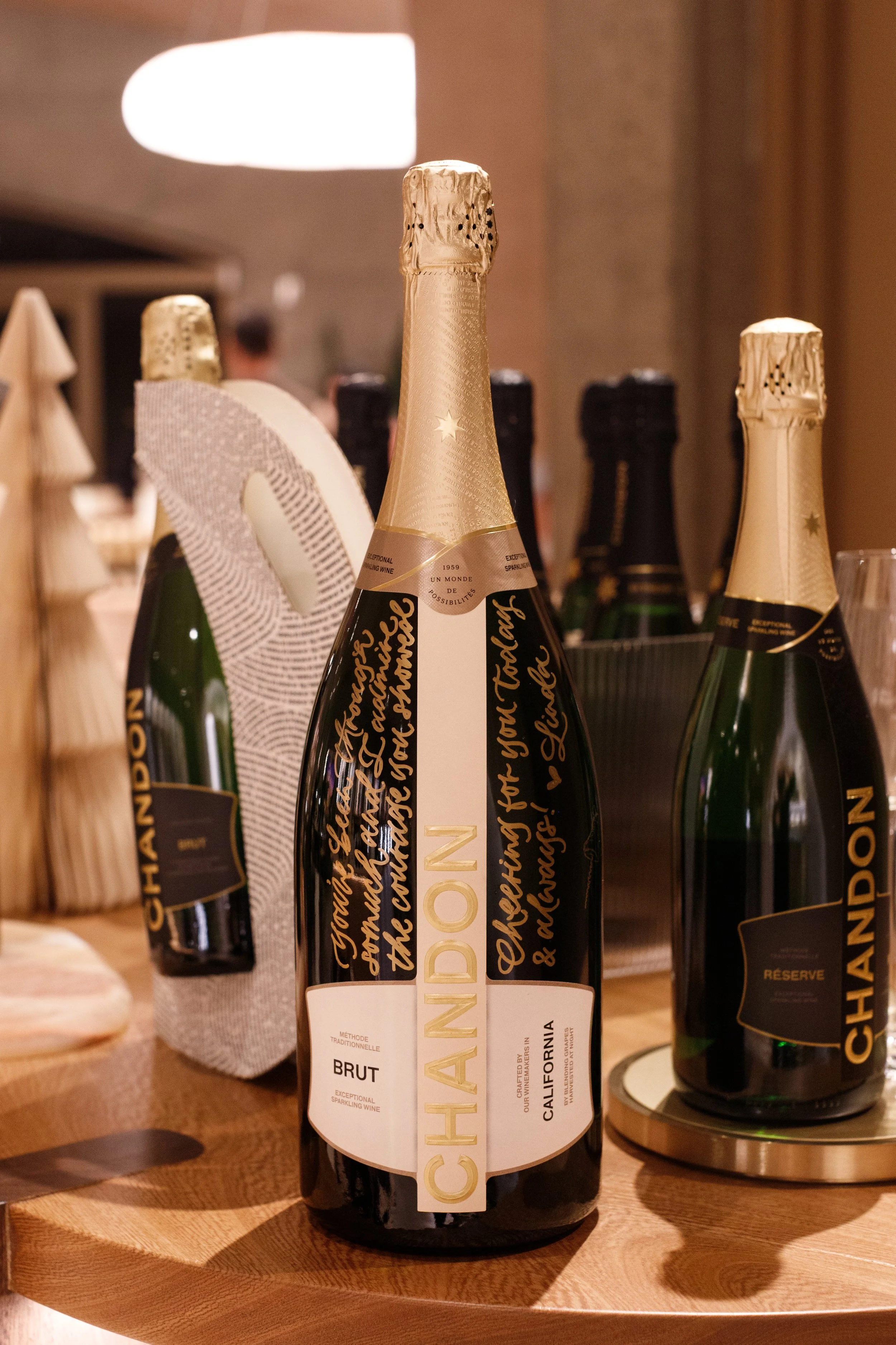 calligraphy-engraving-champagne-wine-liquor-bottles-chandon-winery-activation-event-holiday-unique-gift-idea-message.jpg