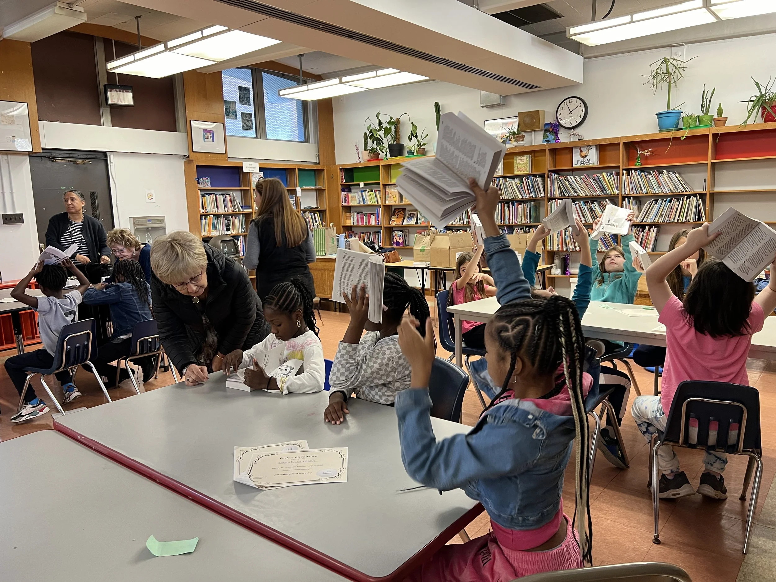   Students at Houston holding up their dictionaries.  