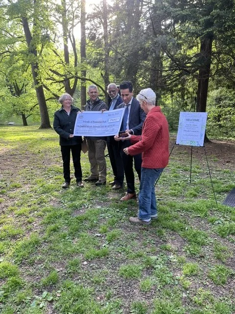 Receiving ceremonial check from DEP 