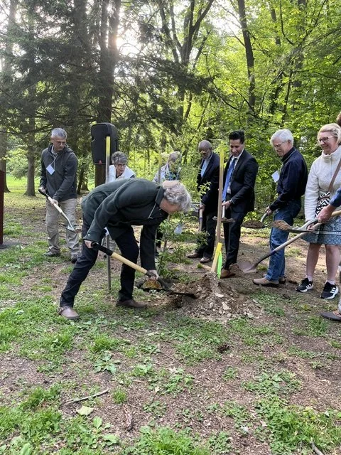 Friends planting tree