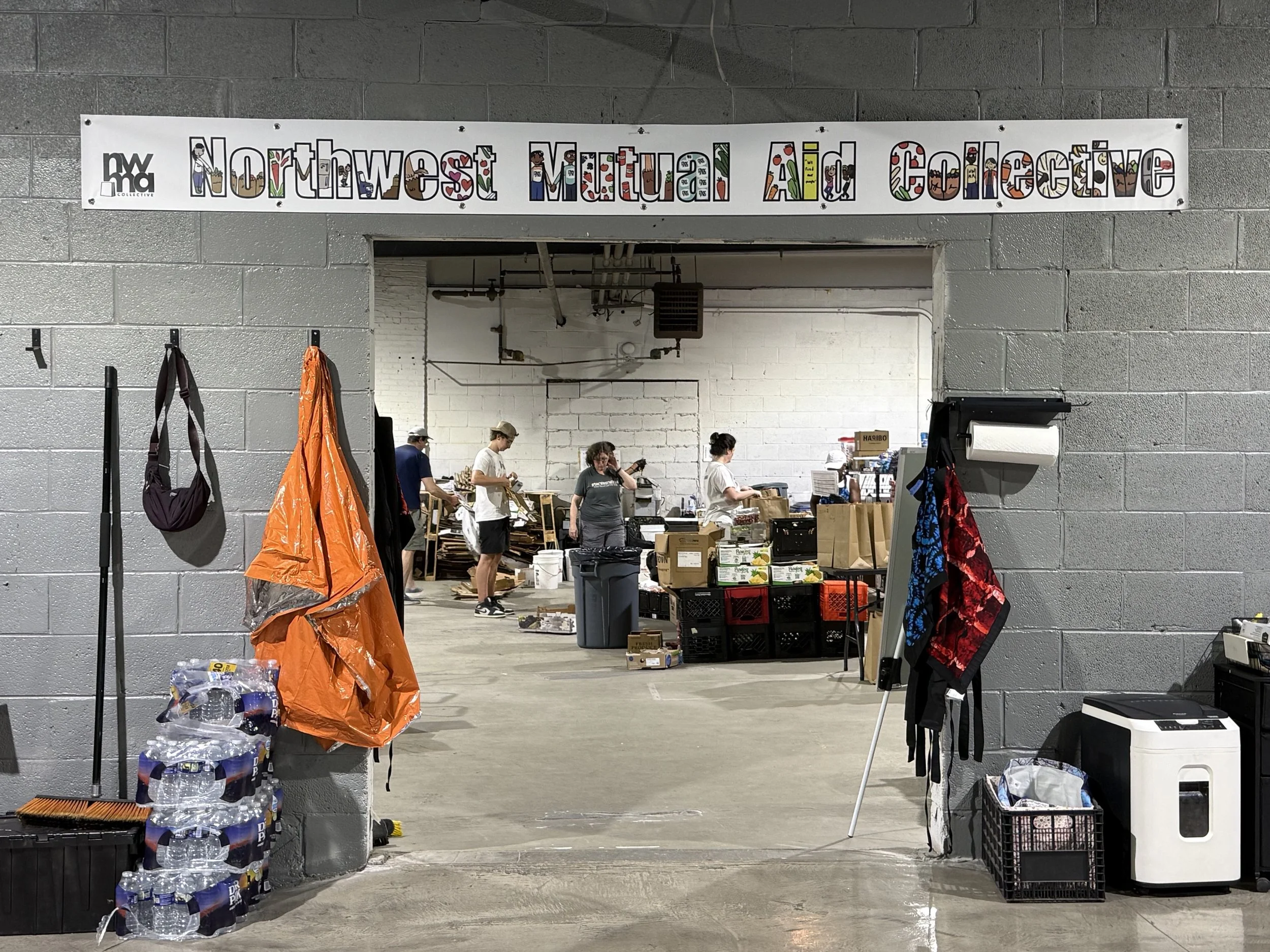 Volunteers at Northwest Mutual Aid Collective warehouse