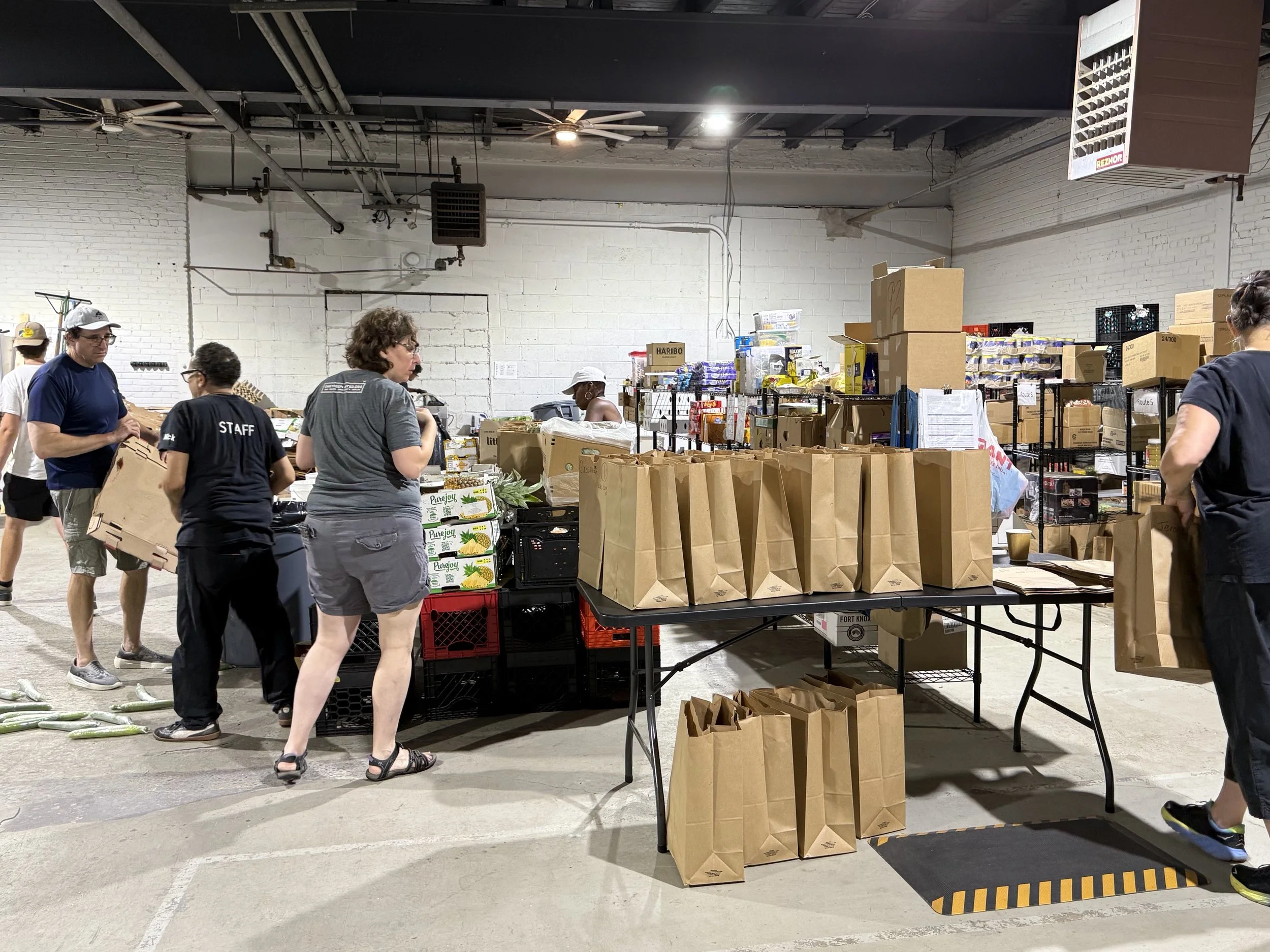 Volunteers packing and sorting food