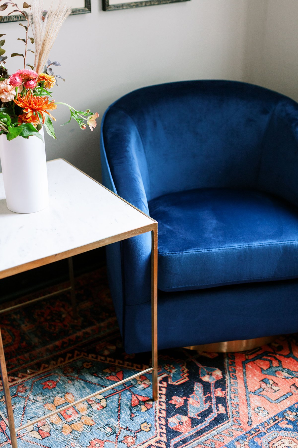 Blue velvet chair-red rug