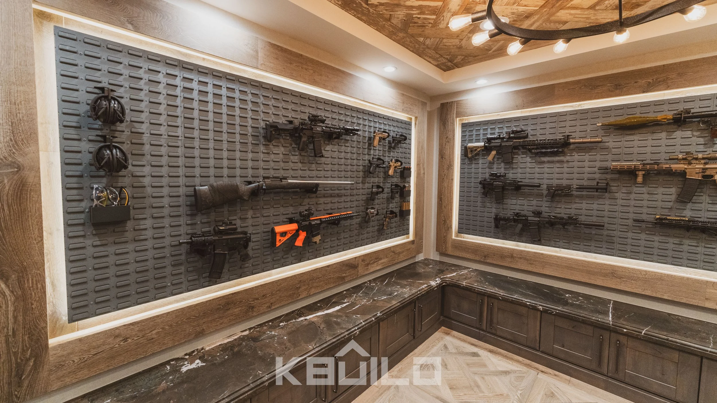 St. Louis custom home gun room with modern weapon display walls, wood accents, marble counters, and LED lighting
