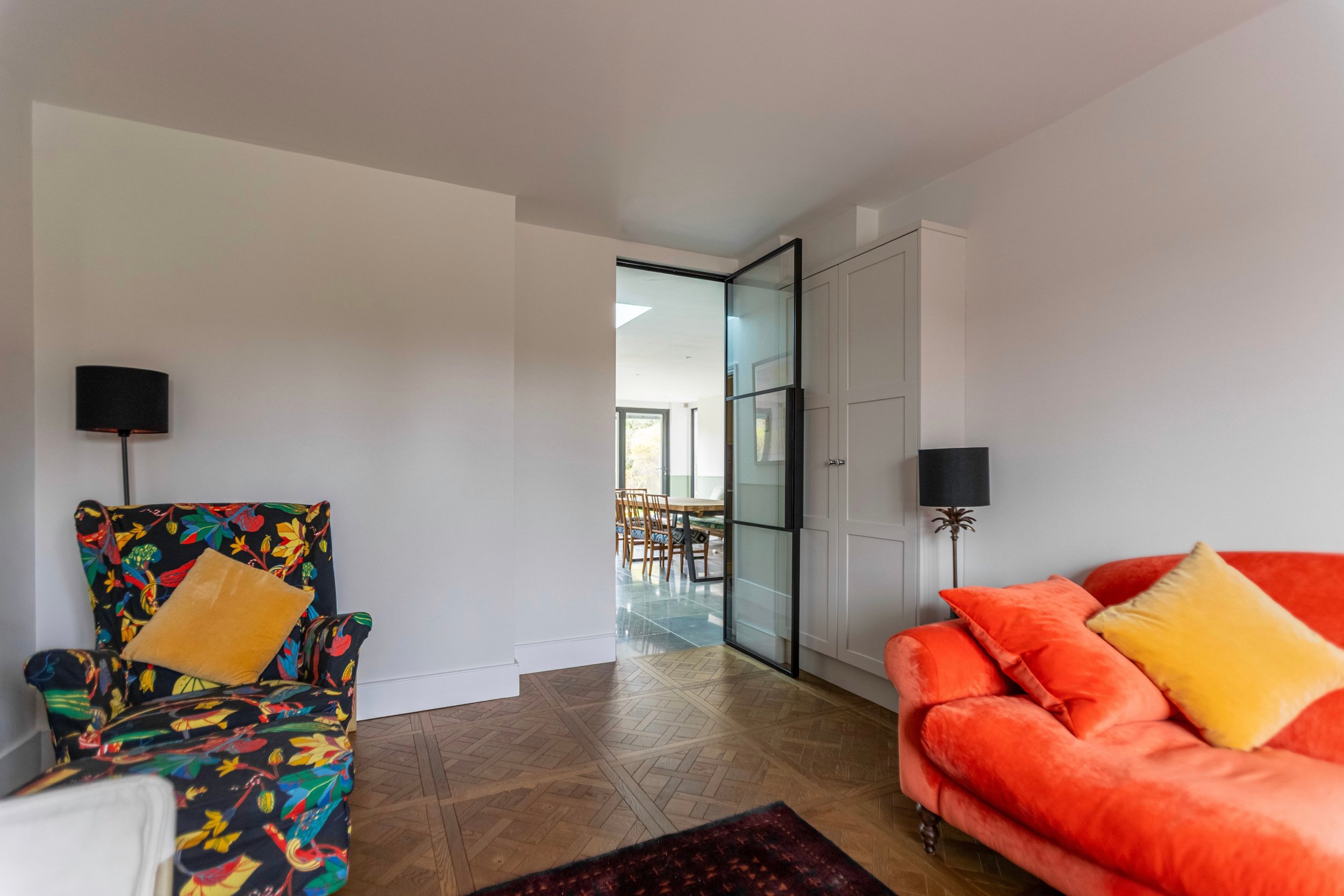 Single internal steel door open between living room and kitchen dining area in Oxted Surrey.