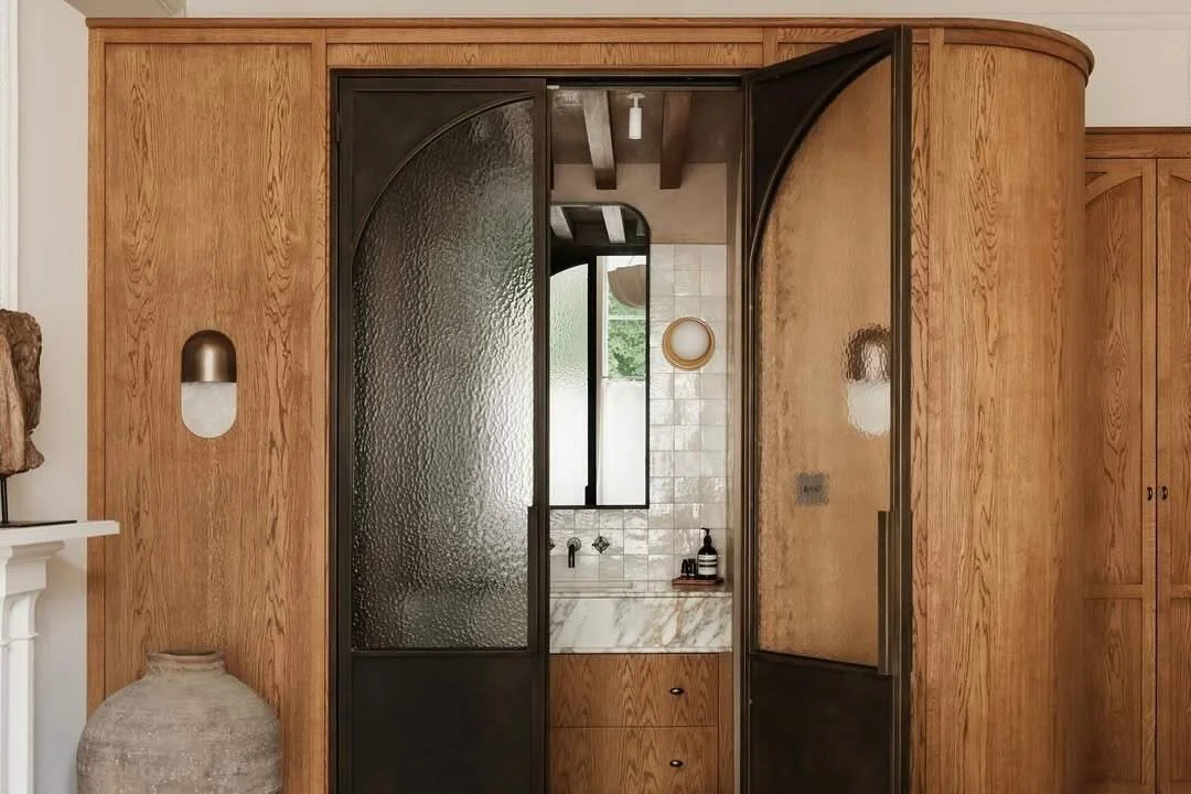 Bespoke steel internal door with metallic finish in a luxury interior