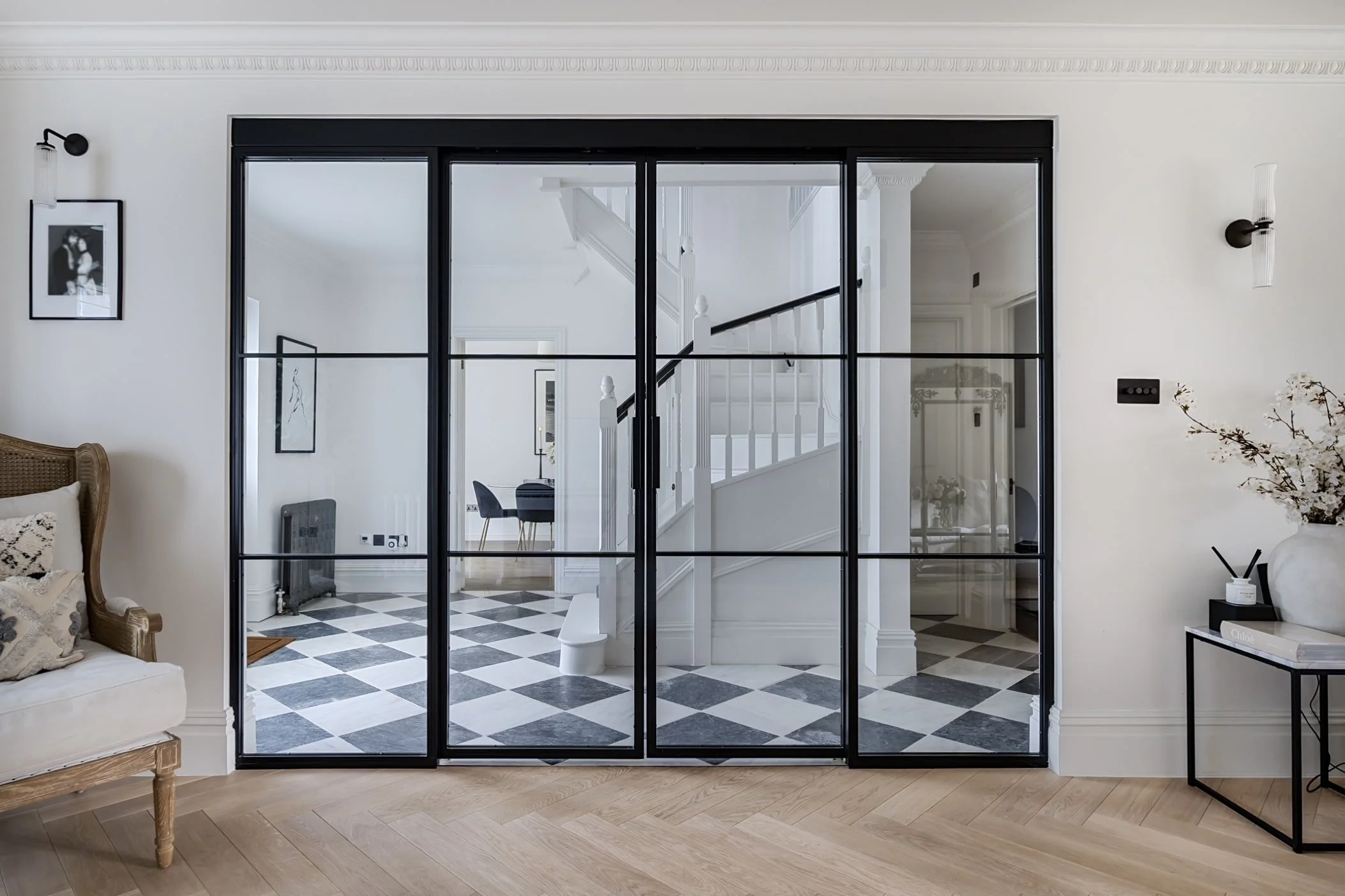 Refined bar layout on a steel sliding door with a clean meeting stile and aligned transoms