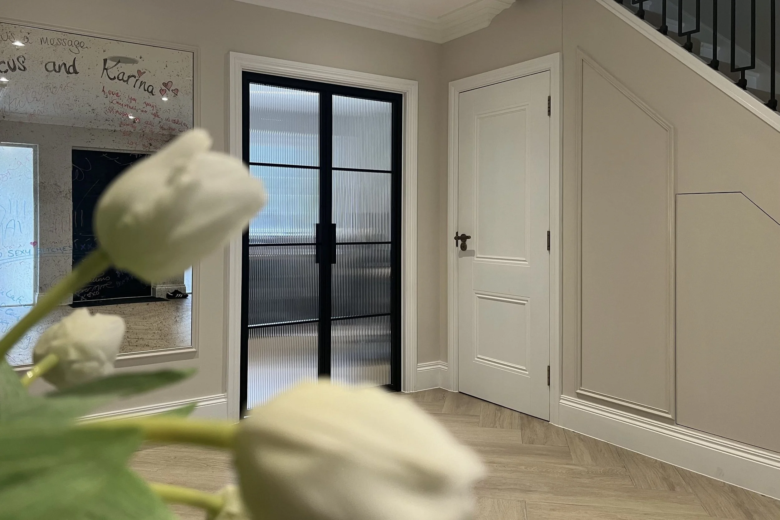 Steel-framed door featuring reeded glass for privacy and texture for a home office