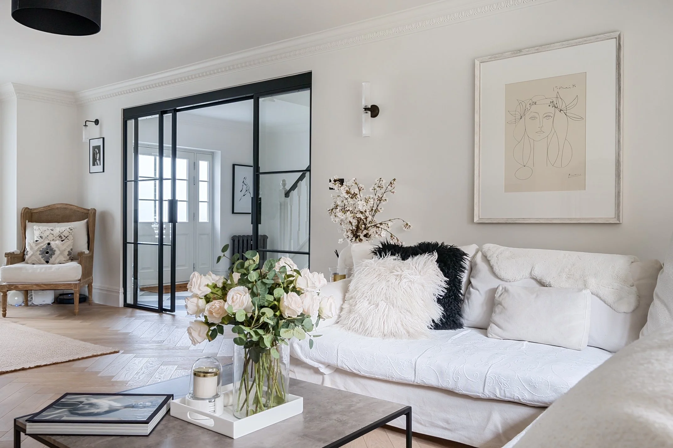 Sliding steel internal door defining space in a UK home