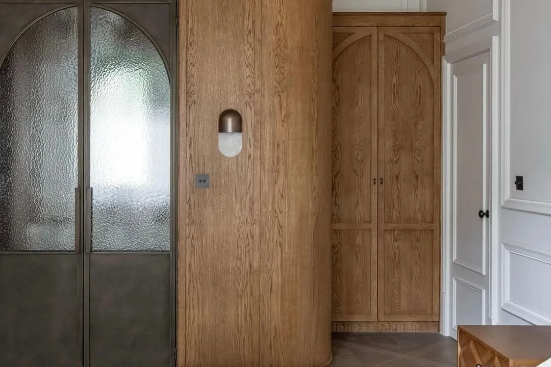 Bespoke steel internal door in bronze premium metal finish within a luxury home interior by Joshua James.