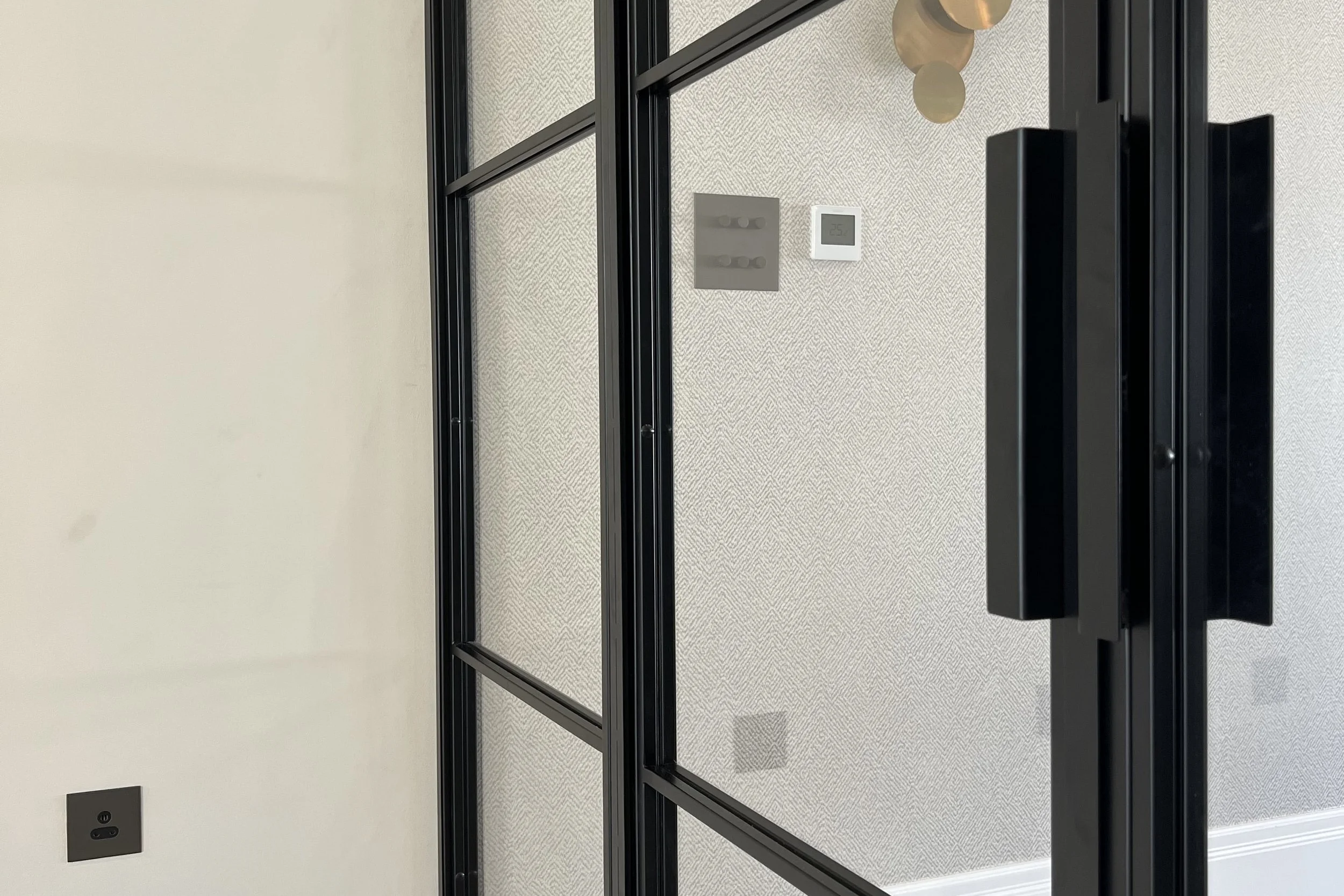 Bespoke steel hinged internal door closed within its frame showing rebate detail by Joshua James.