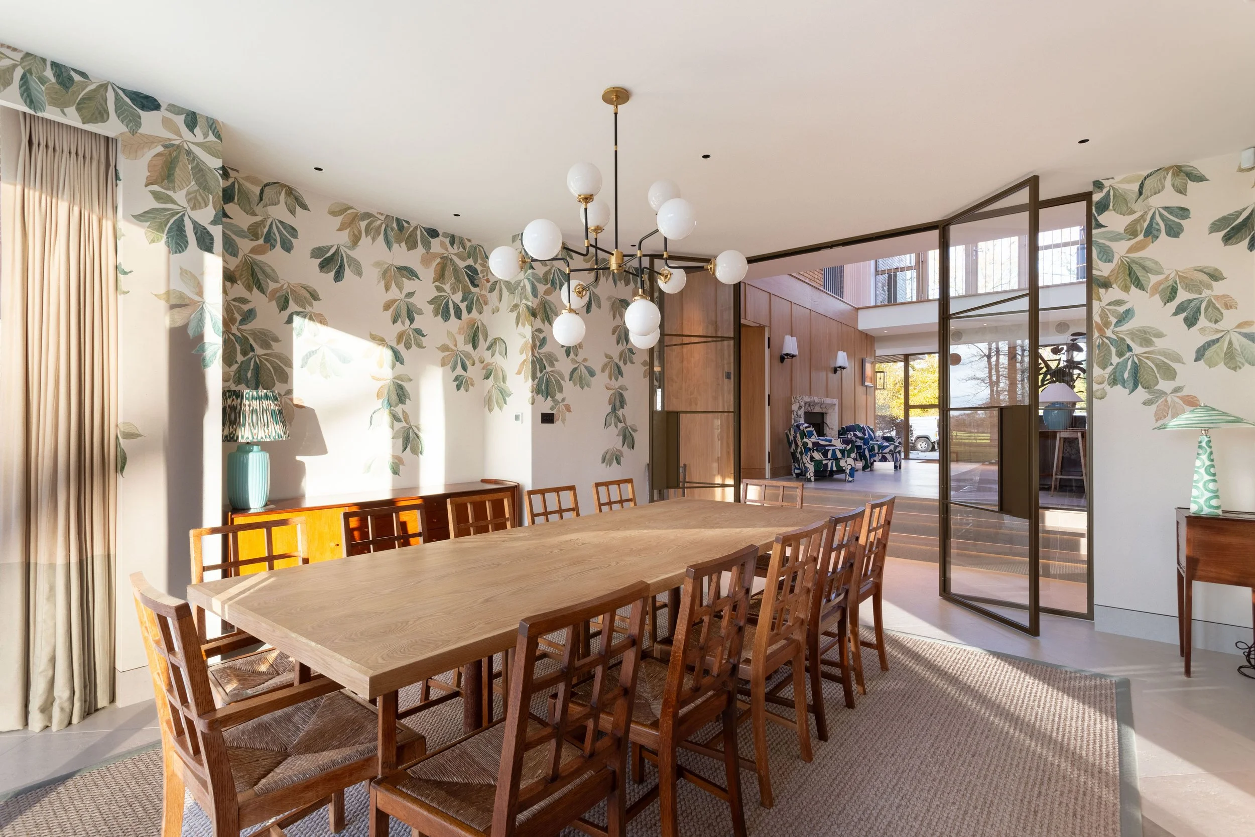 Steel internal doors in a UK luxury home defining the entrance hallway