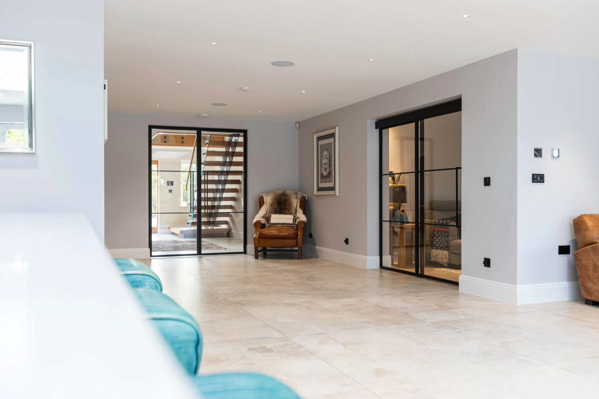Bespoke steel internal sliding and hinged doors in a luxury home interior by Joshua James.