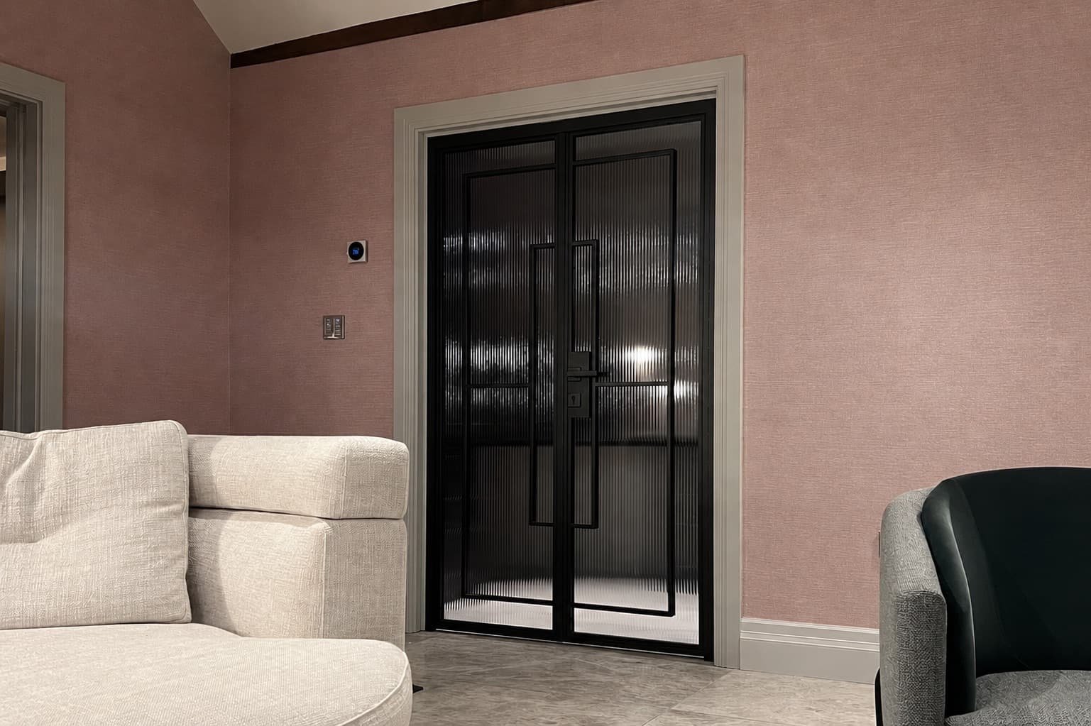 ange of bespoke steel internal door configurations in a luxury residential interior by Joshua James.
