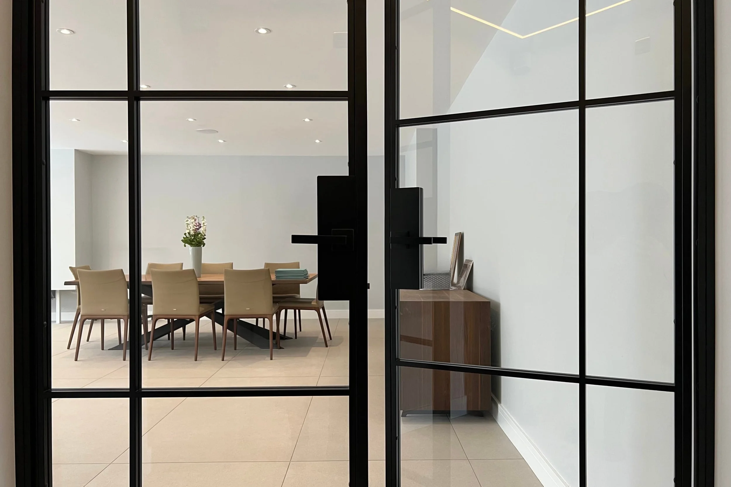 Close-up detail of the centre meeting point and rebate on a Joshua James bespoke double steel internal door set.