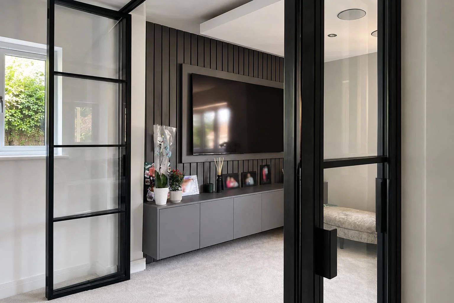 Bespoke InoCross20 steel internal bi-folding doors in a residential home in Hornchurch Essex by Joshua James.