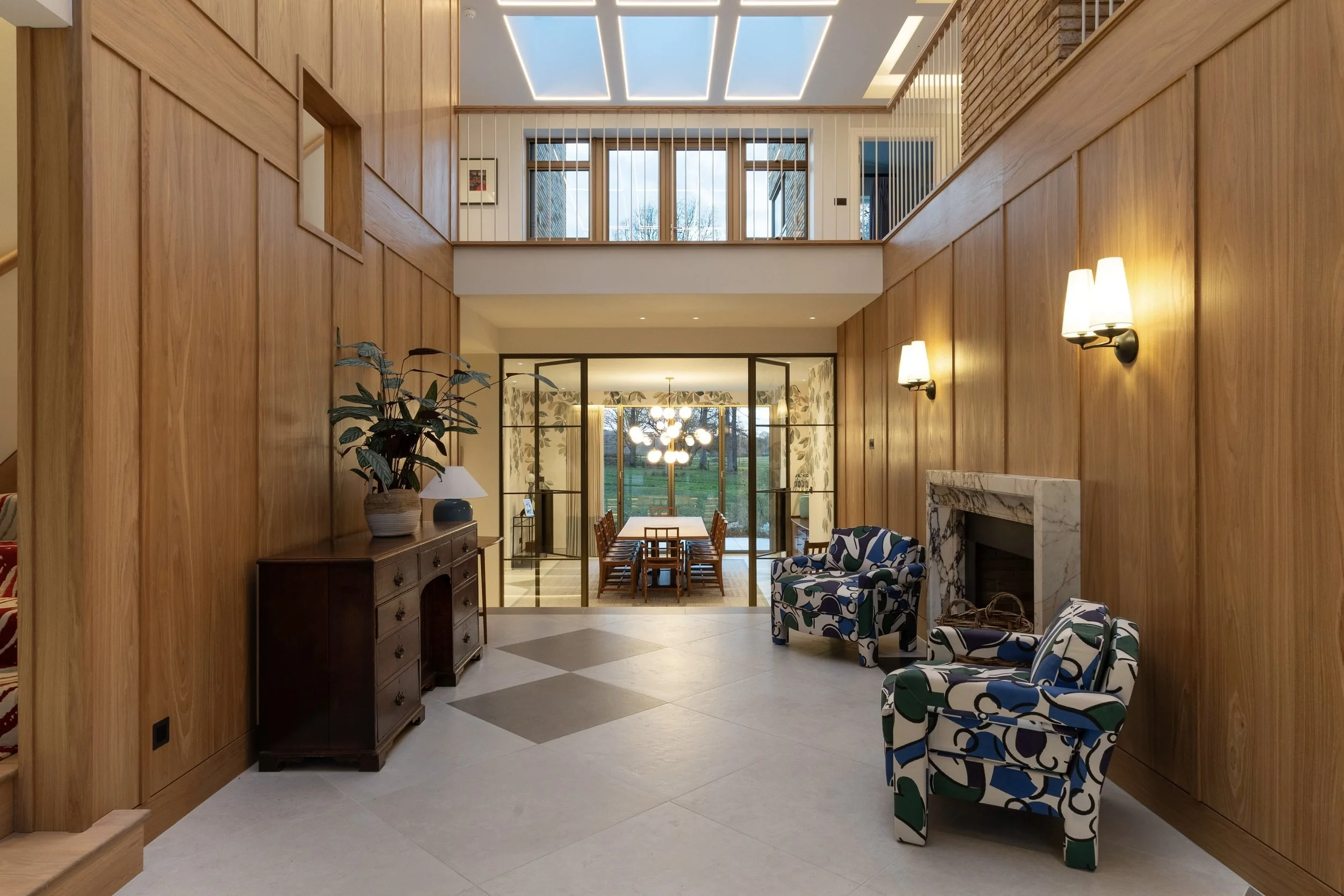 Full-height steel internal door planned early in a renovation to maximise ceiling height and light