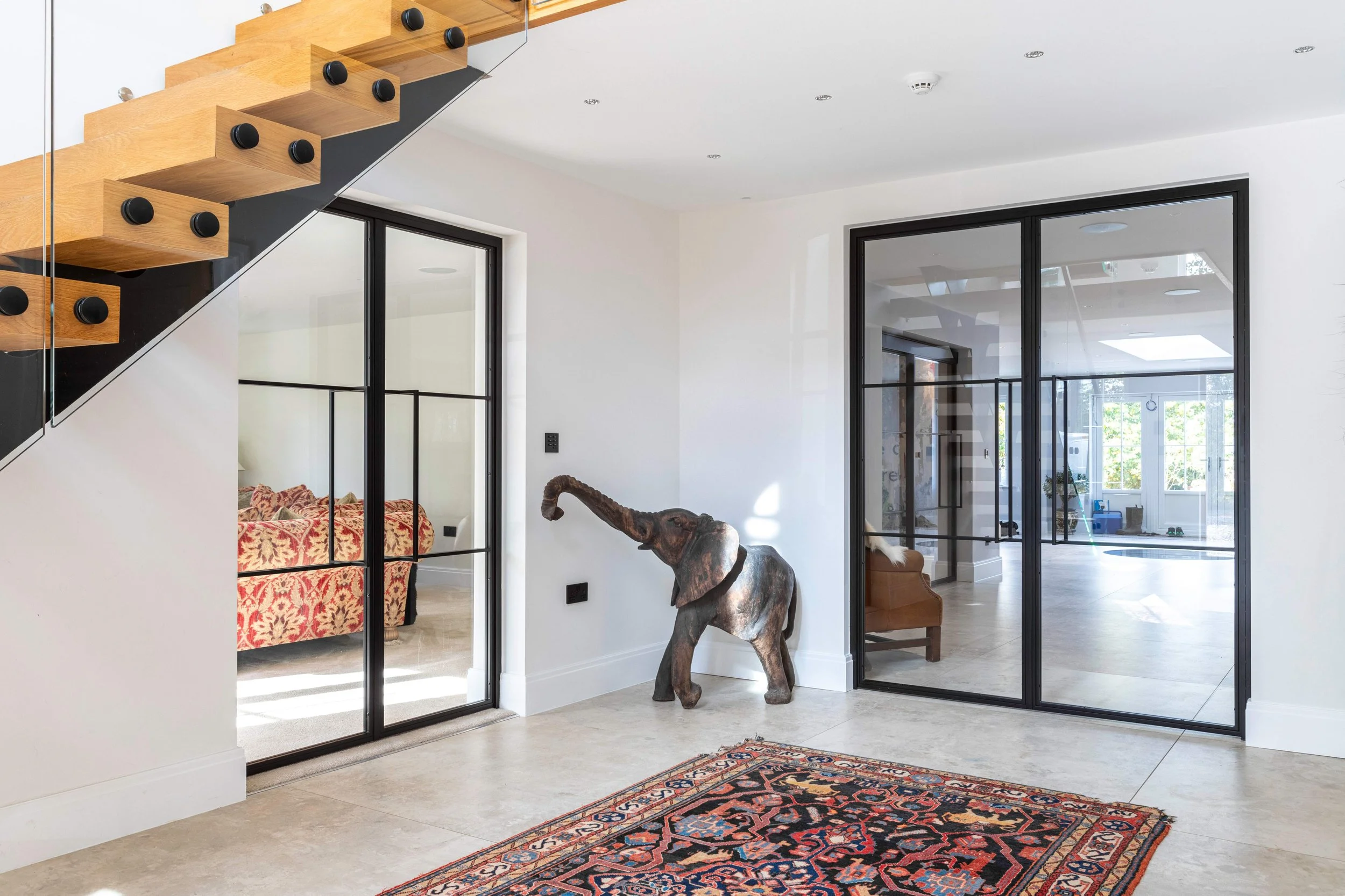 Bespoke steel internal doors installed in a finished luxury home renovation by Joshua James.