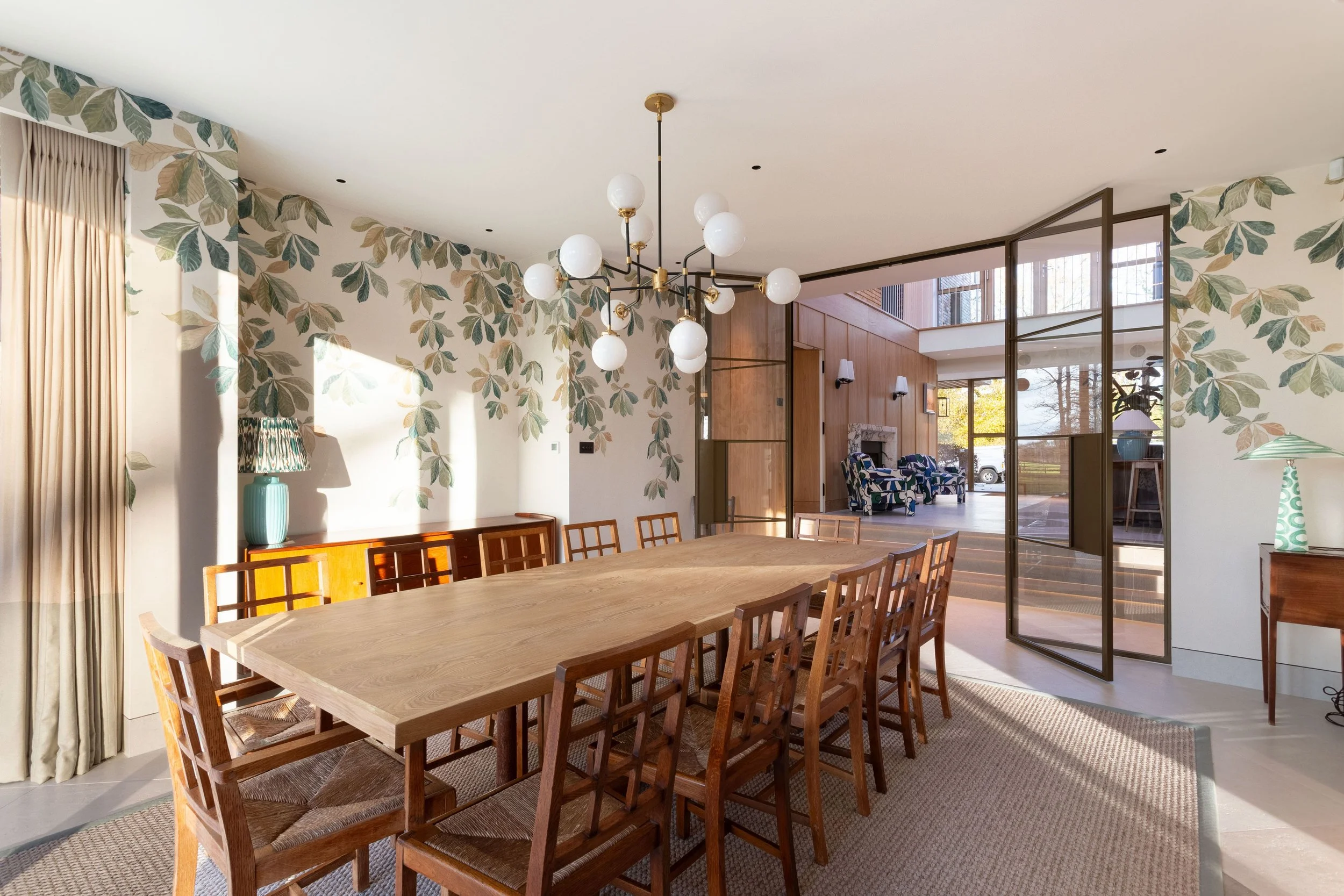 Bronze steel doors with side screens creating a statement hallway entrance in Kent.
