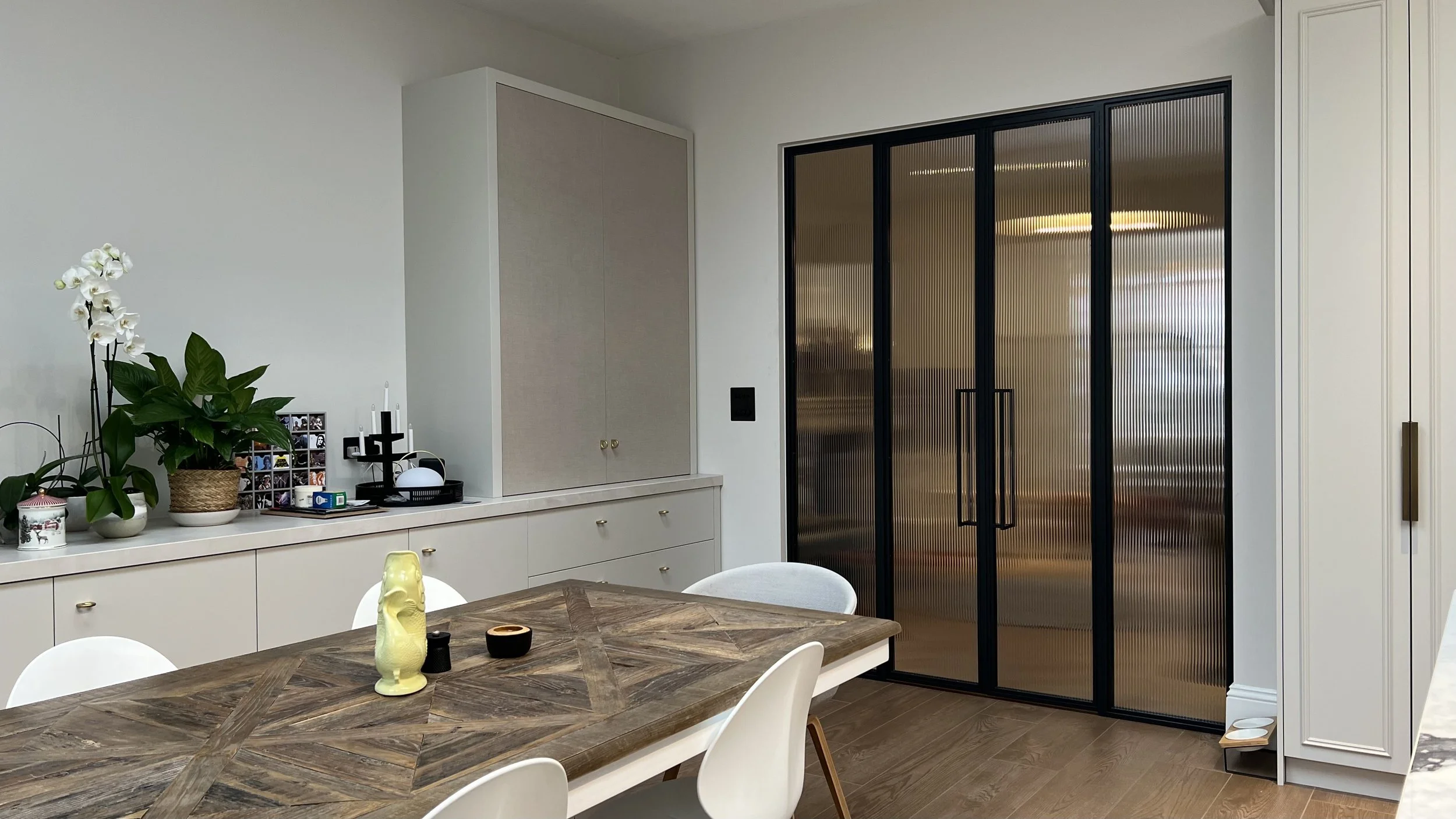 Steel internal doors allowing light to flow between rooms in a UK home