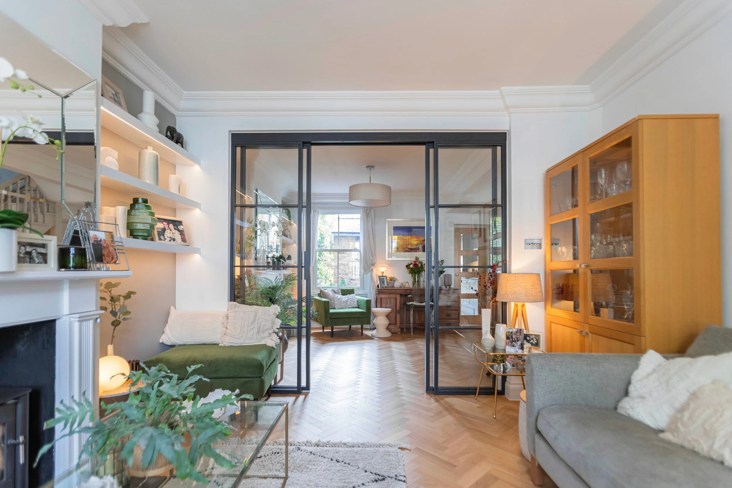 Bespoke steel internal doors dividing an open plan living space in a luxury home by Joshua James.