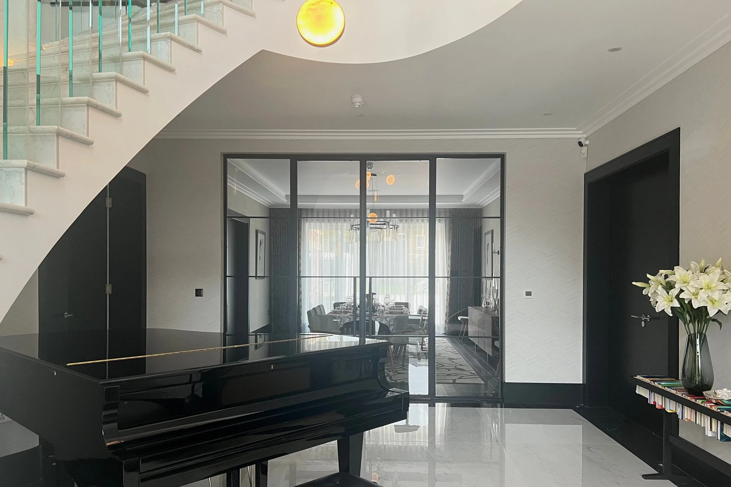 Bespoke matt black steel internal door in a luxury home interior by Joshua James.