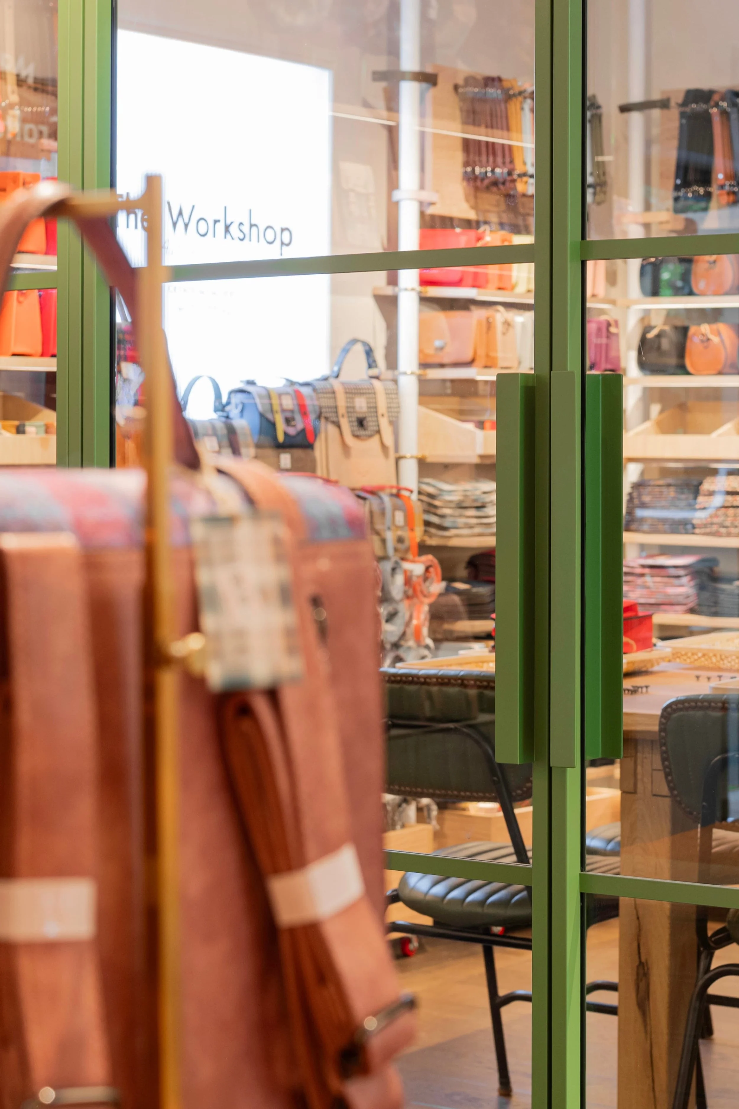 Close-up of the Trim handle on Joshua James steel-framed glazing at Islander UK's Covent Garden workshop entrance.