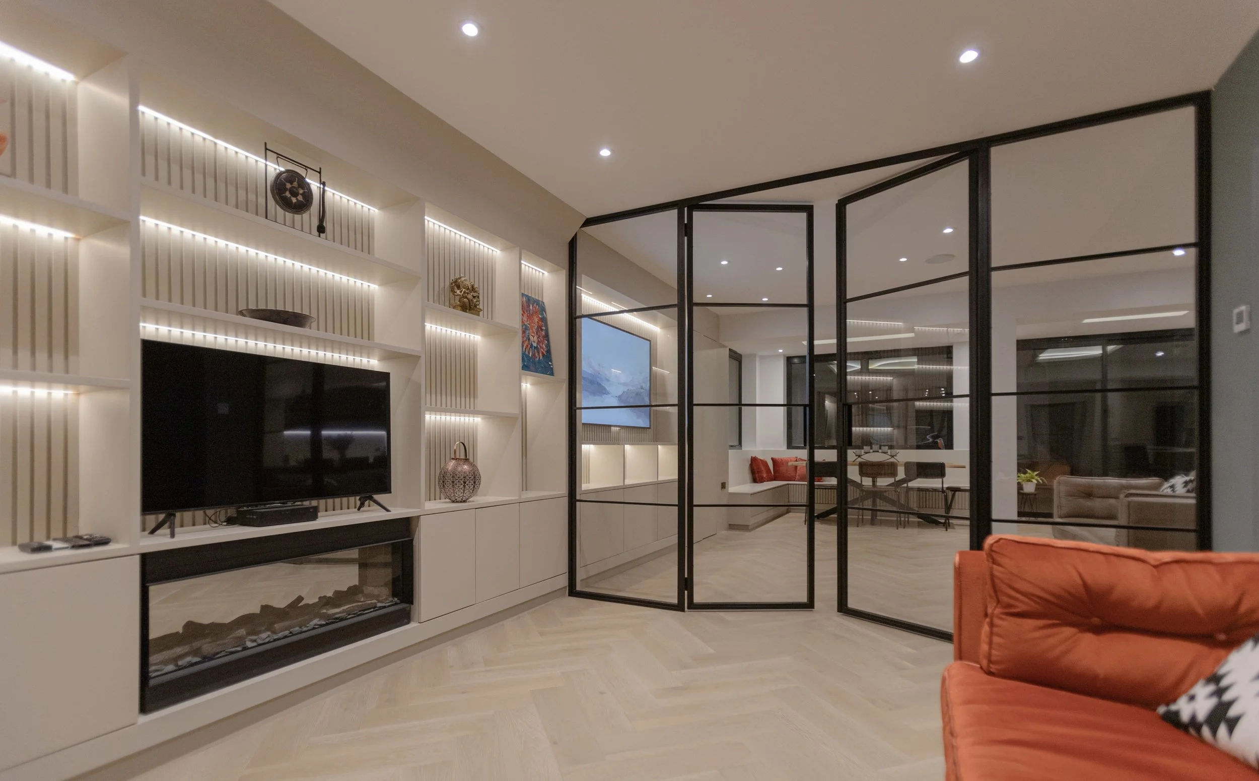 Steel doors and screens dividing an open plan luxury home without losing natural light