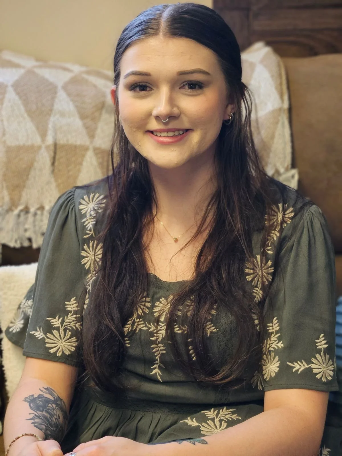 Alexis Wilson, LCSW, a therapist at Dandelion Therapy Group in North Port, FL, smiling in a headshot against a neutral background.