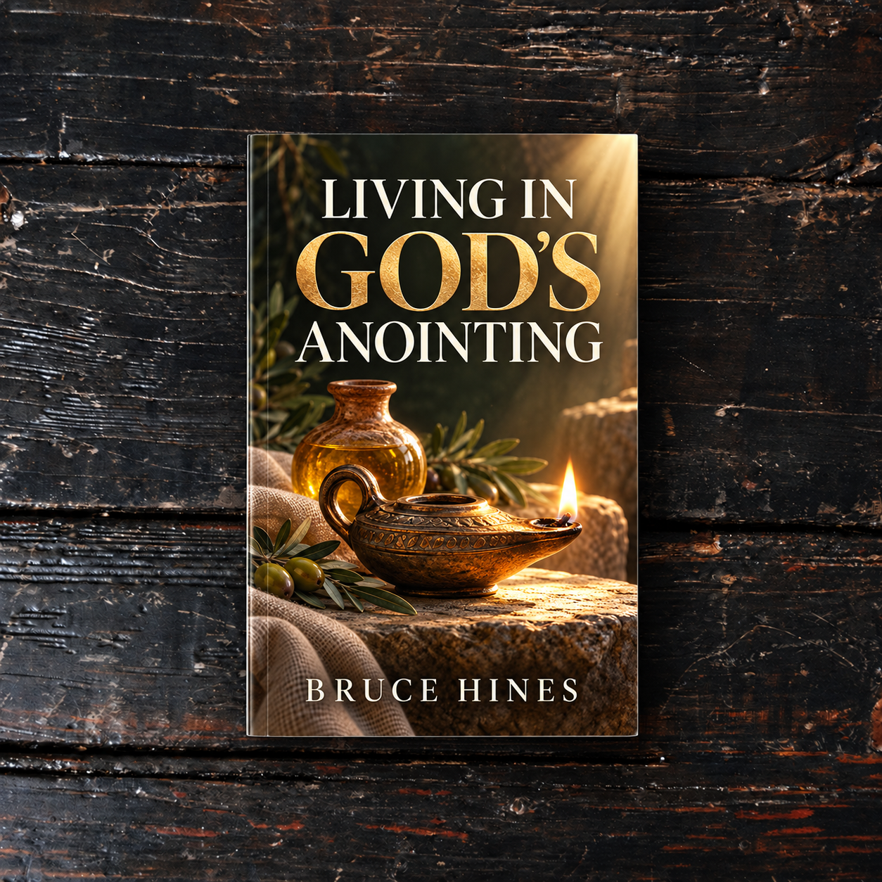 Living in God’s Anointing by Bruce Hines, cover displayed on a dark wood background