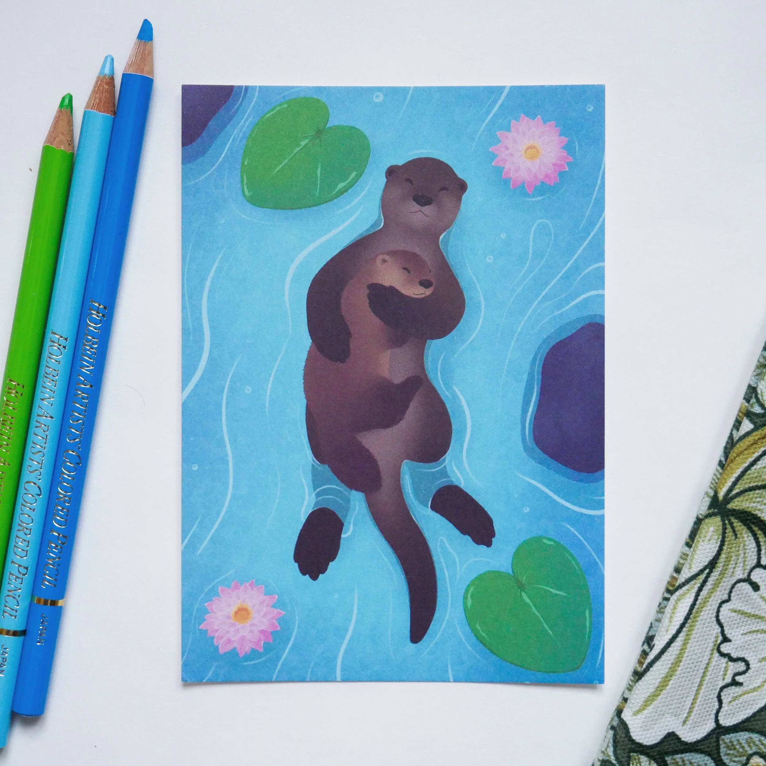 "Otter Family Hug" postcard
