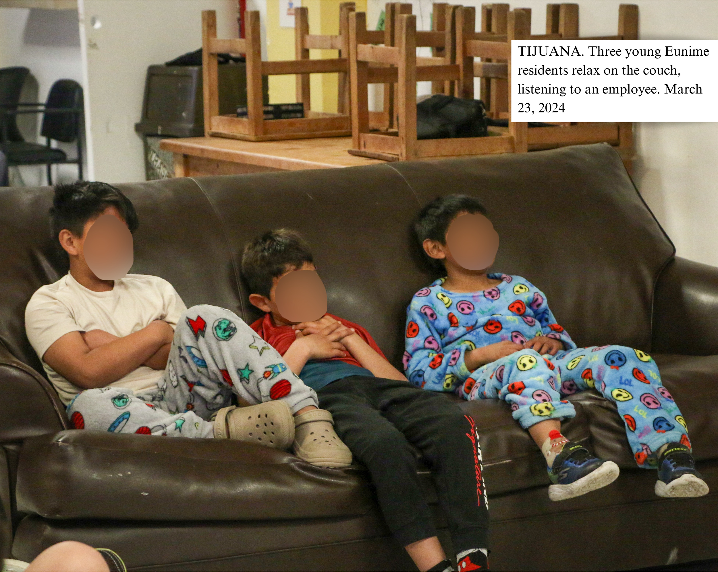 TIJUANA, MX Three young residents of Eunime relax on the couch, listening to an employee..png