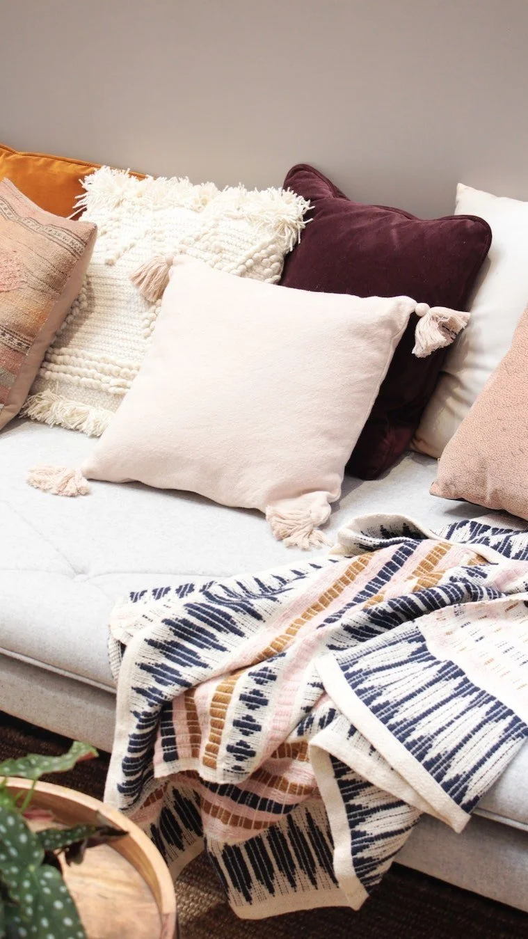 A couch with pillows and blanket provides comfort and safety during online brainspotting trauma therapy in Los Angeles and online throughout CA