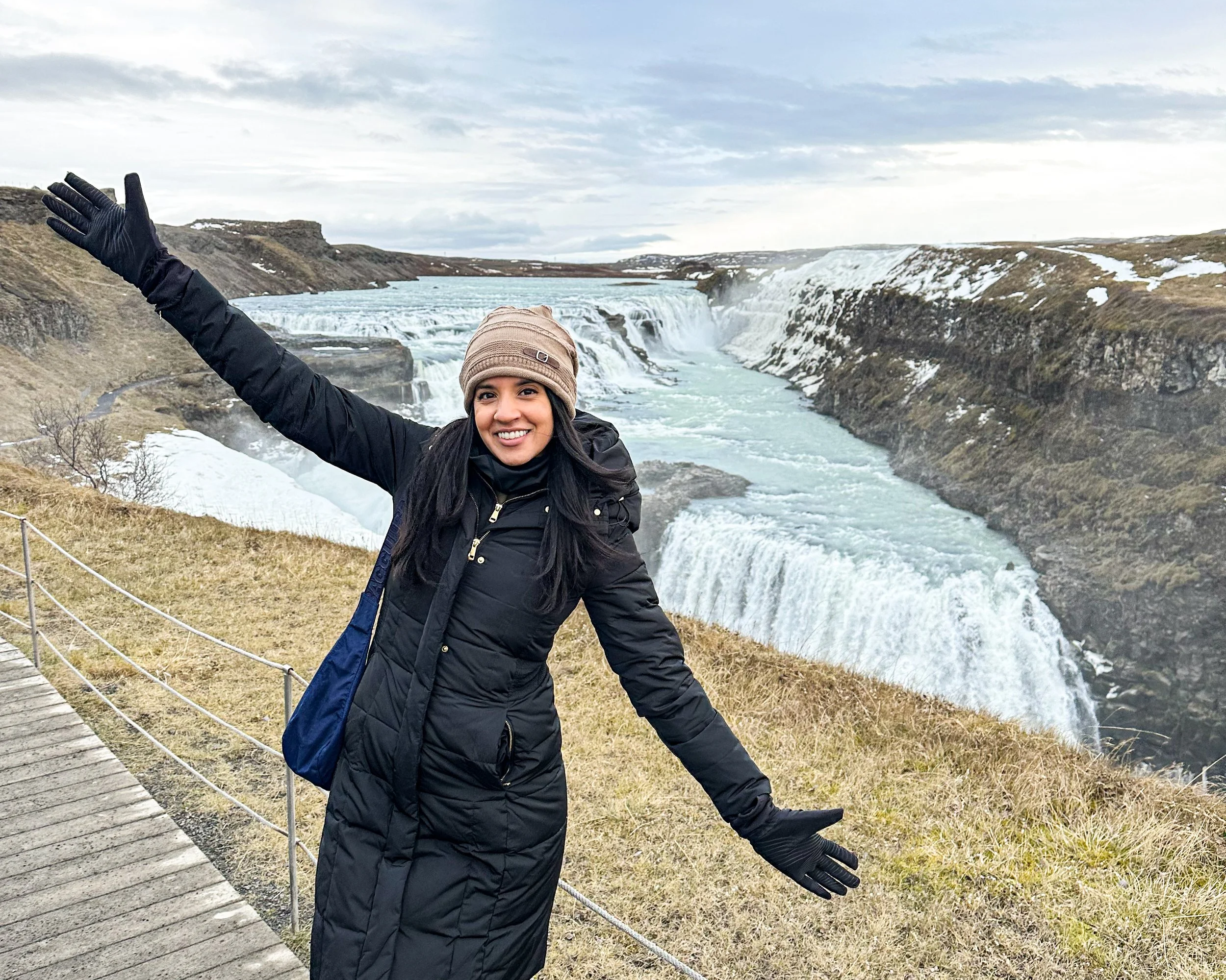 Ashley standing in front of Gullfoss waterfall in Iceland