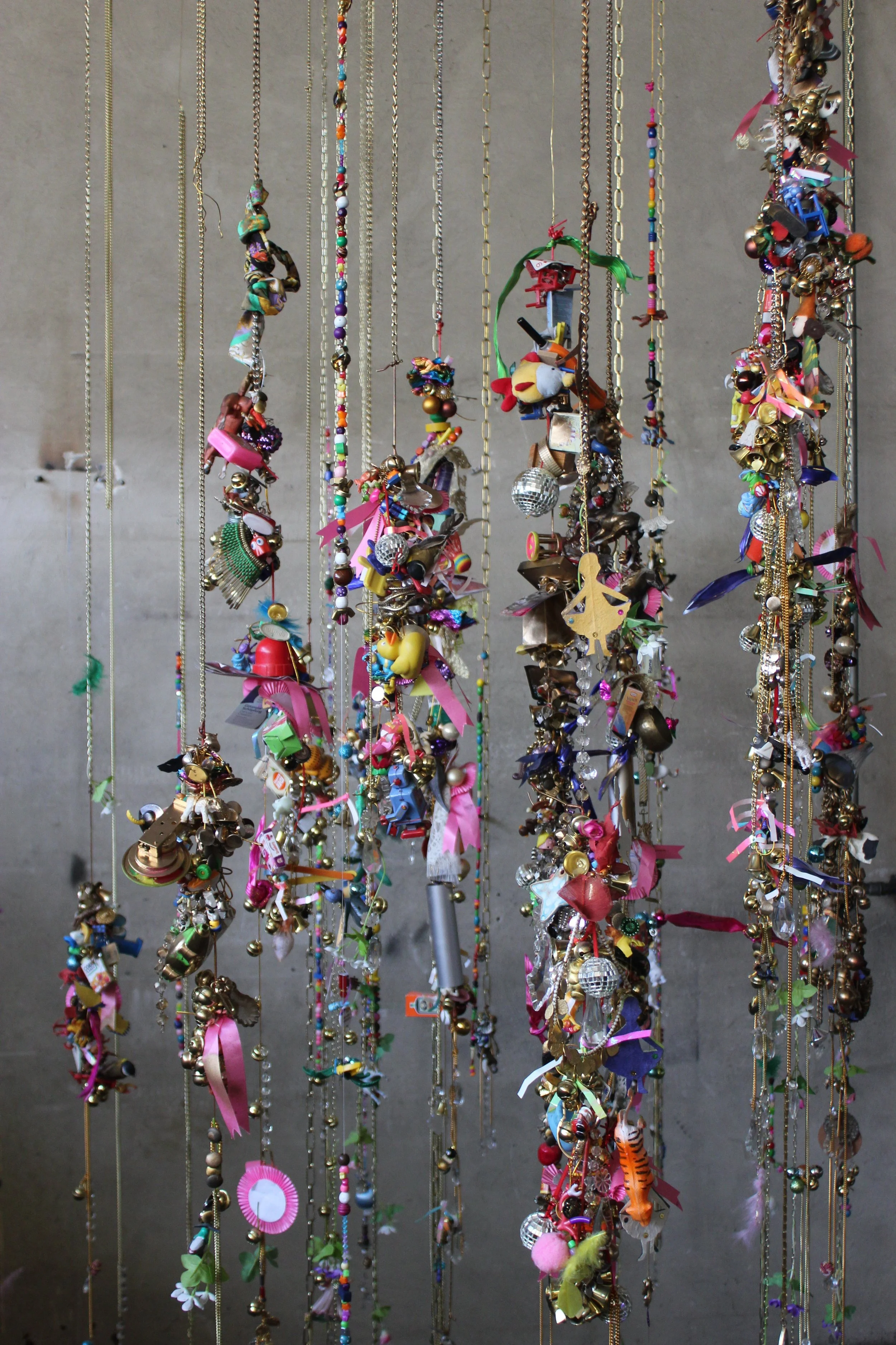 Luck, 2022, Installation, metal chains, found objects, toys, jewellery, approx  6 m long