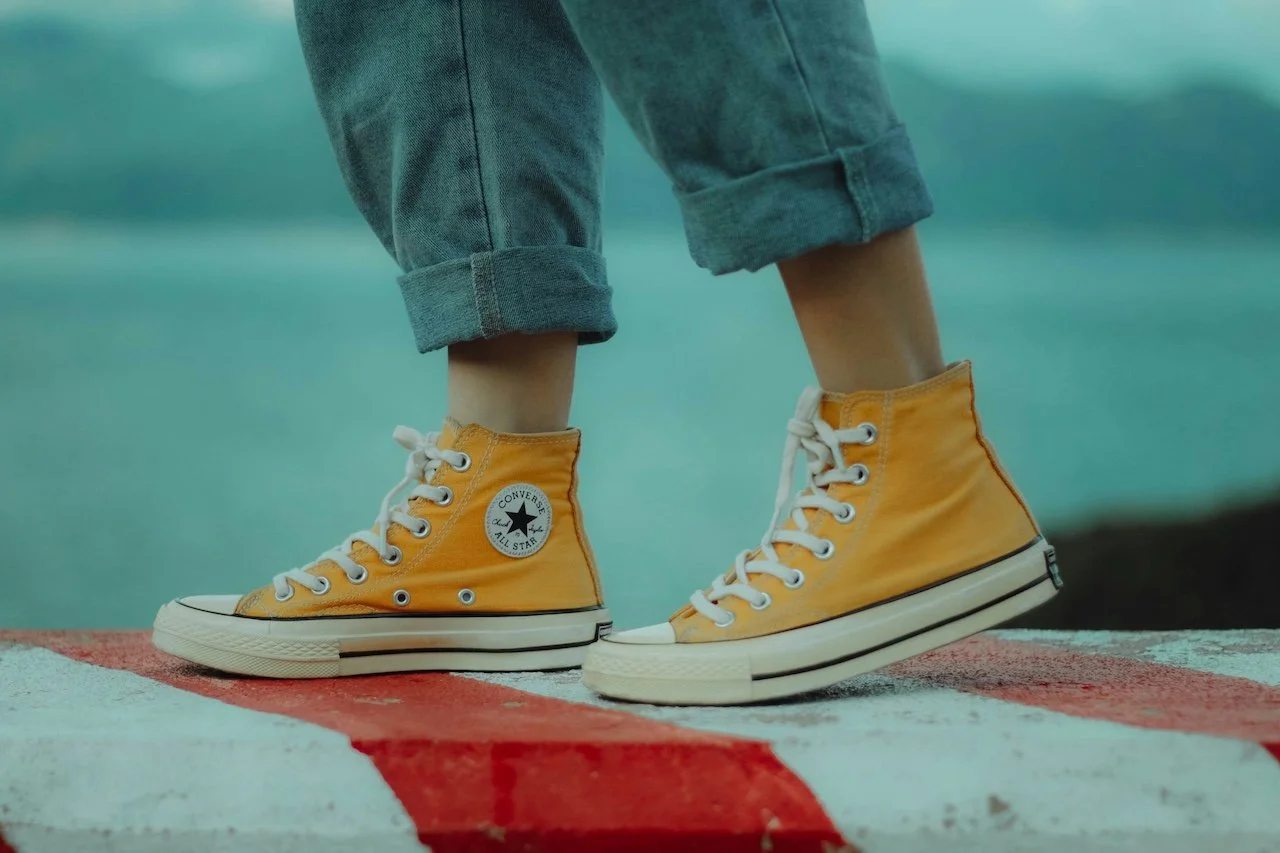 Close-up of yellow shoes walking