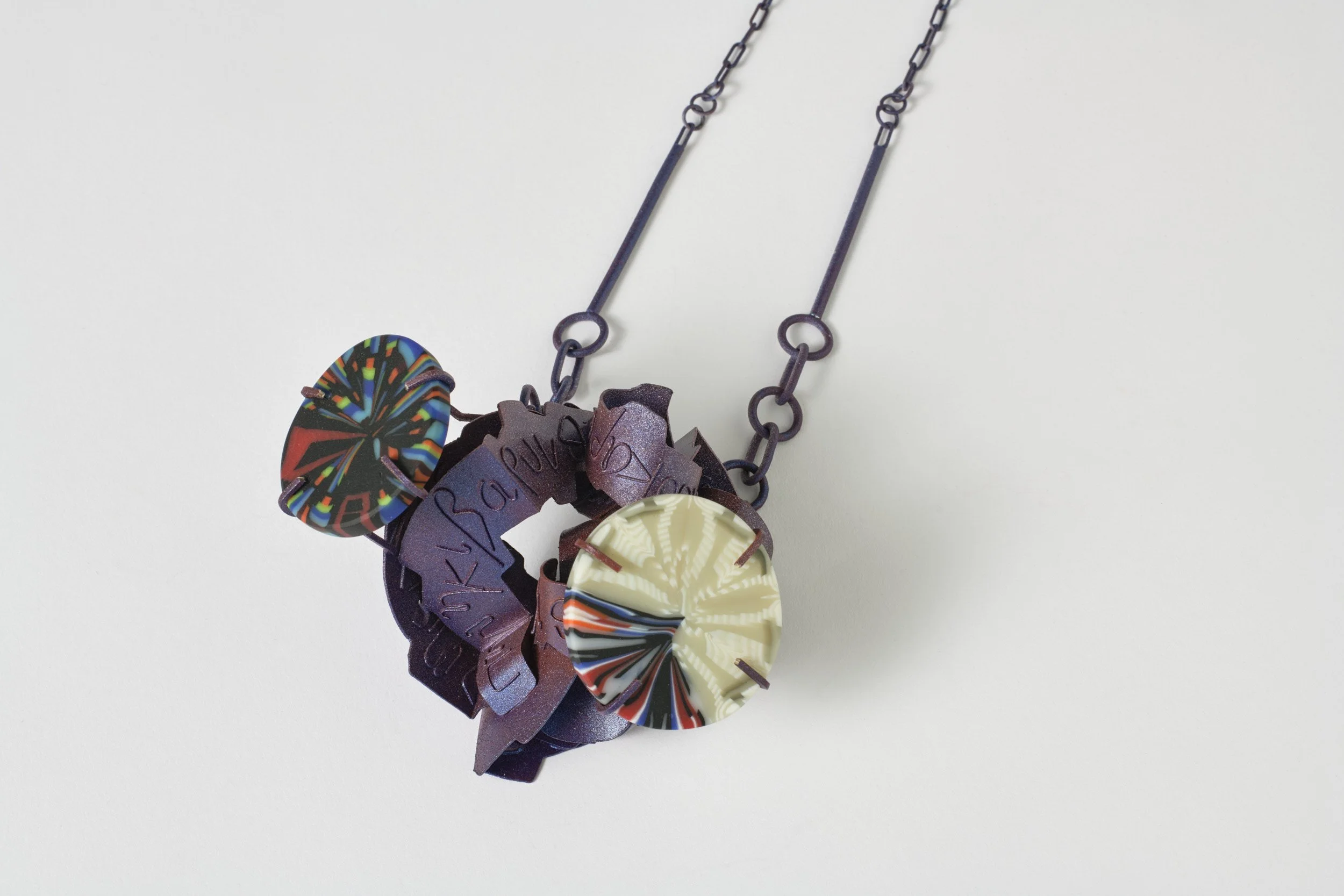  Hyperintense , 2026
 (neckpiece)
 sterling silver, bullseye glass, paint
 450 x 120 x 80 mm
  $2,550