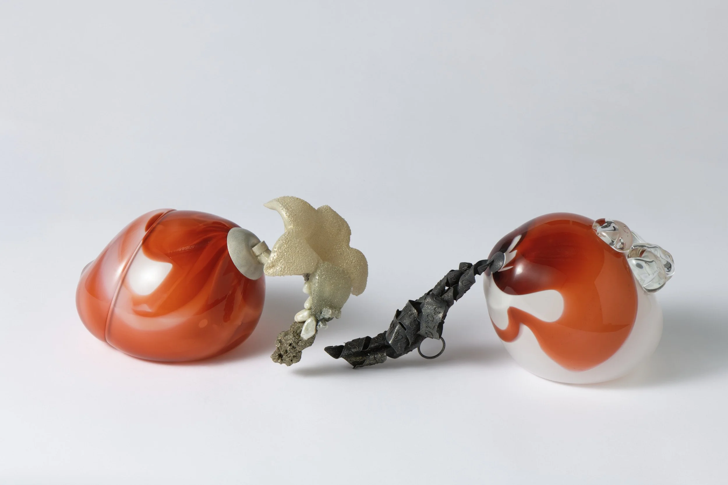  Phaos , 2025-2026
 (object with removable wearable ring)
Br blown glass, silver alloy, oxidised sterling silver, cast glass, pearls, glass beads, crushed glass, pistacia lentiscus resin, epoxy, pyrite, crushed calcite, paint, alexandrite
 480 x 155 