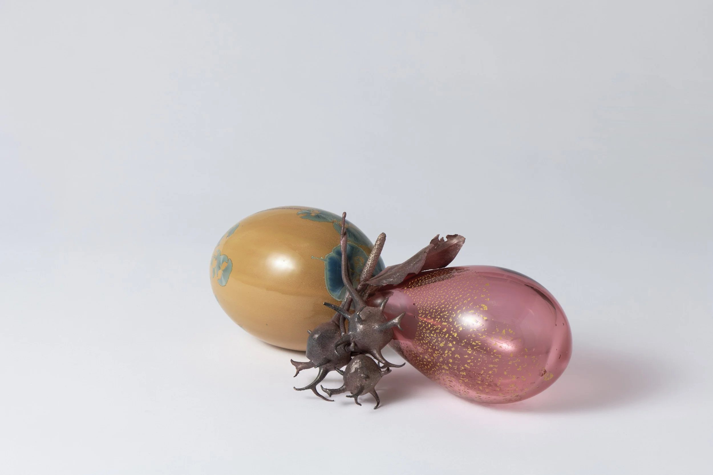 ἄξων|áxōn axis , 2025-2026
 glazed porcelain, blown glass, gold, bronze, copper, paint, glass beads, epoxy, shibuichi alloy
 310 x 160 x 110 mm
  $2,850